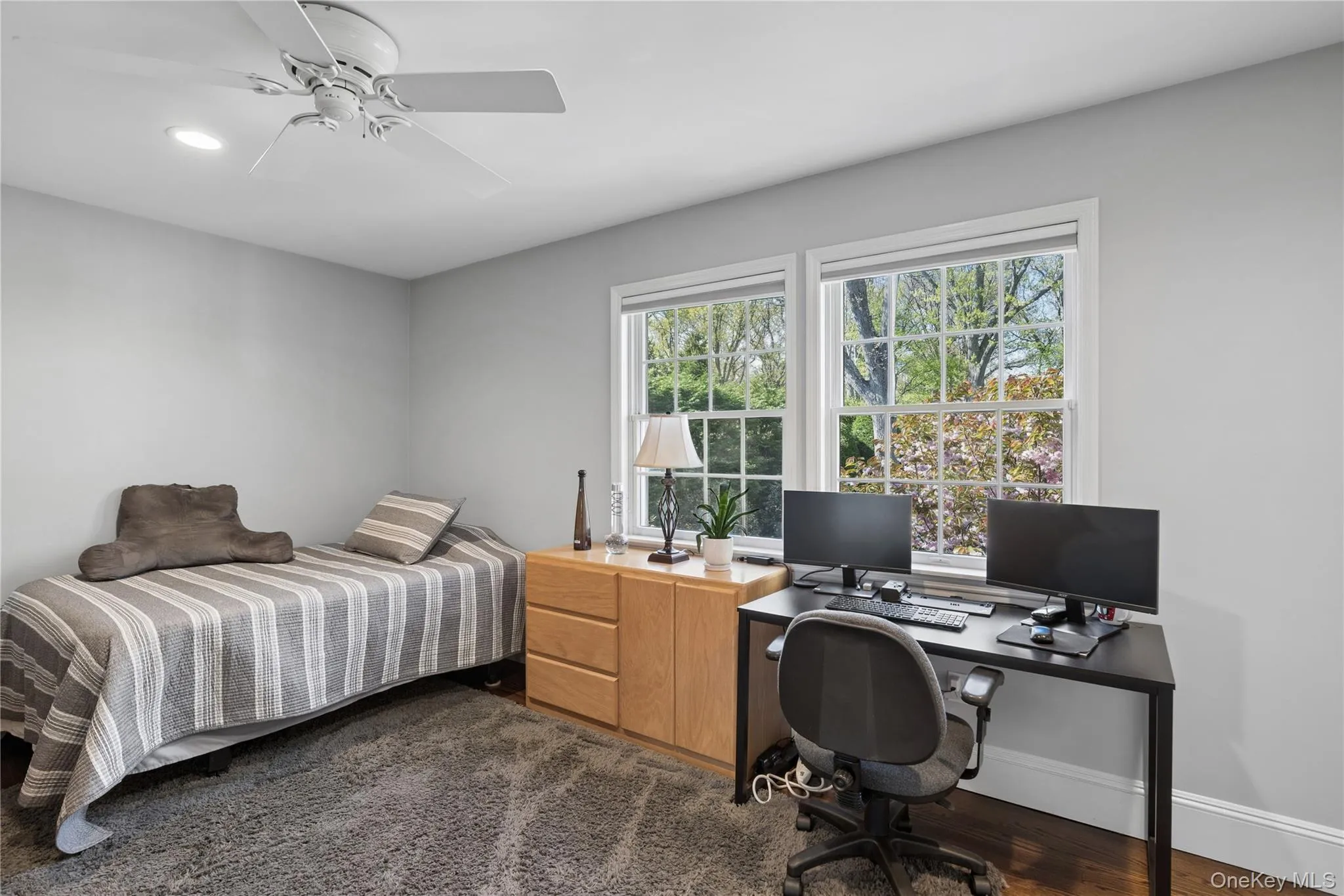 Bedroom, ceiling fan and Hardwood flooring under carpet Bedroom, ceiling fan and Hardwood flooring under carpet