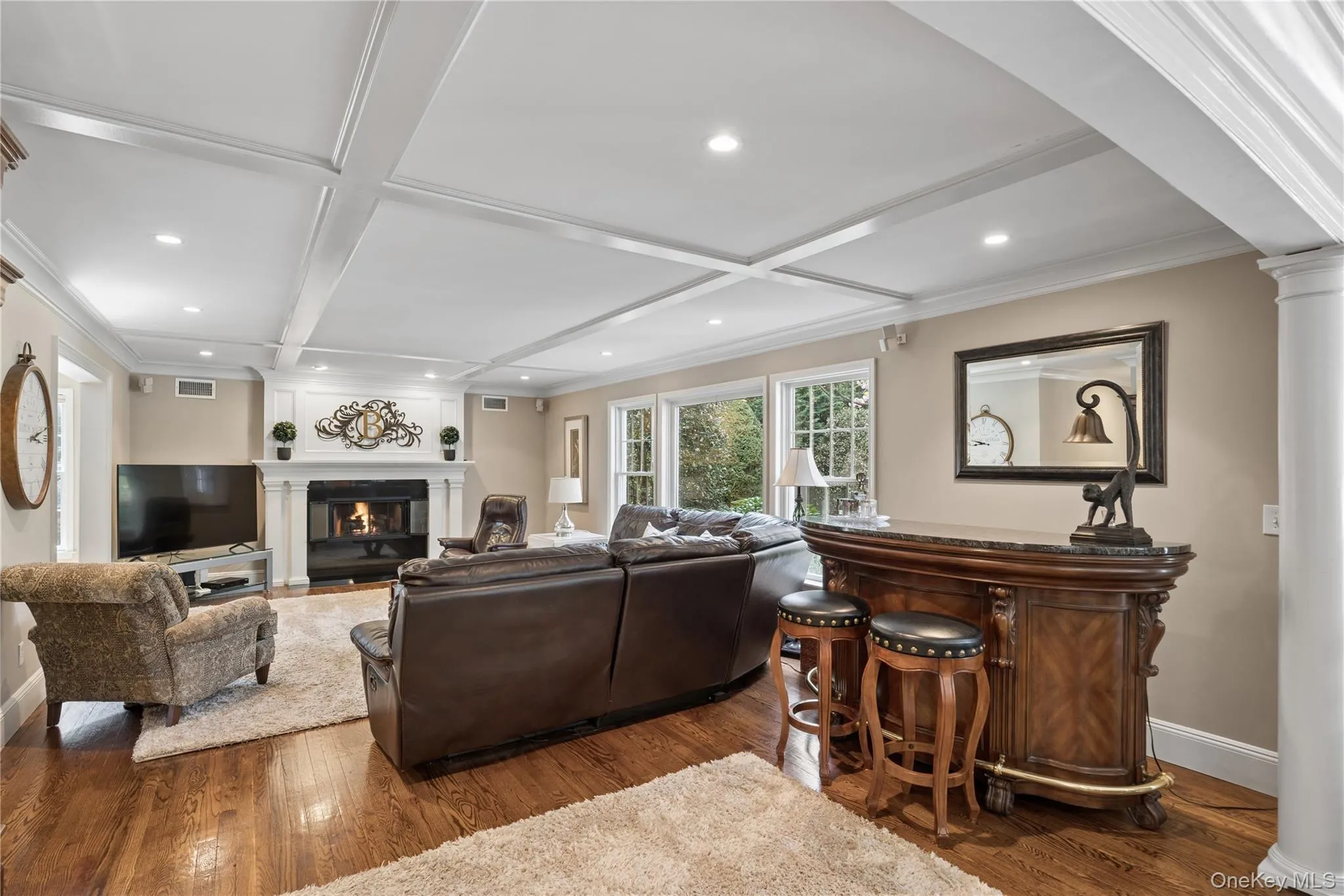 Den, GAS Fireplace, granite hearth and accent molding above fireplace. Picturesque windows Den, GAS Fireplace, granite hearth and accent molding above fireplace. Picturesque windows