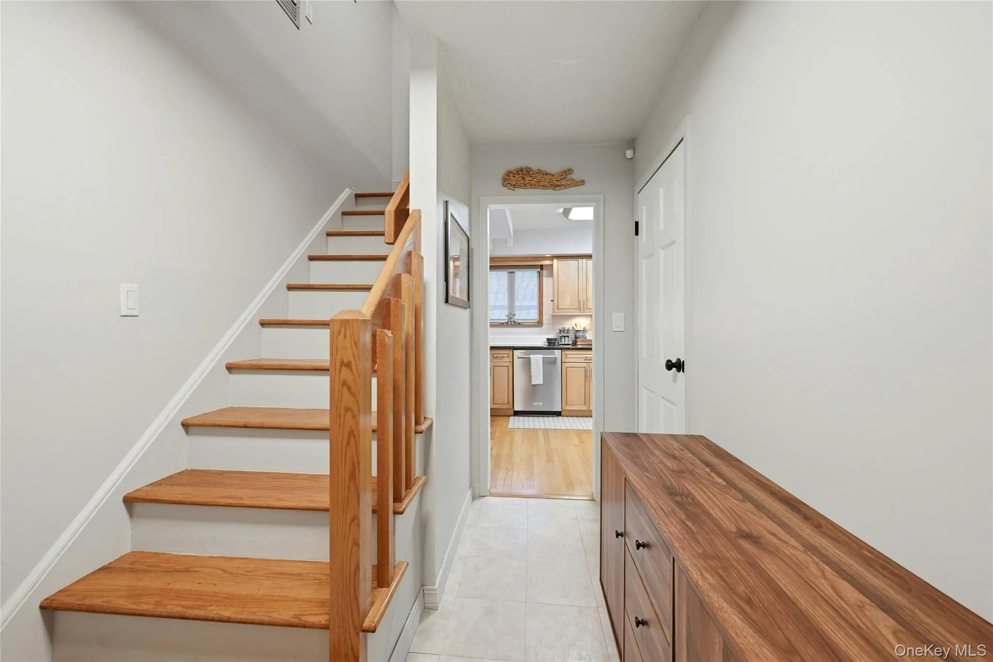 A Lovely Entrance Foyer Offers Two Closets, A Beautiful Stairway To The Second Level With Oak Railings & Steps/Treads, And The Entrance Foyer Opens Into The Formal Living Room & The Eat In Kitchen. A Lovely Entrance Foyer Offers Two Closets, A Beautiful Stairway To The Second Level With Oak Railings & Steps/Treads, And The Entrance Foyer Opens Into The Formal Living Room & The Eat In Kitchen.