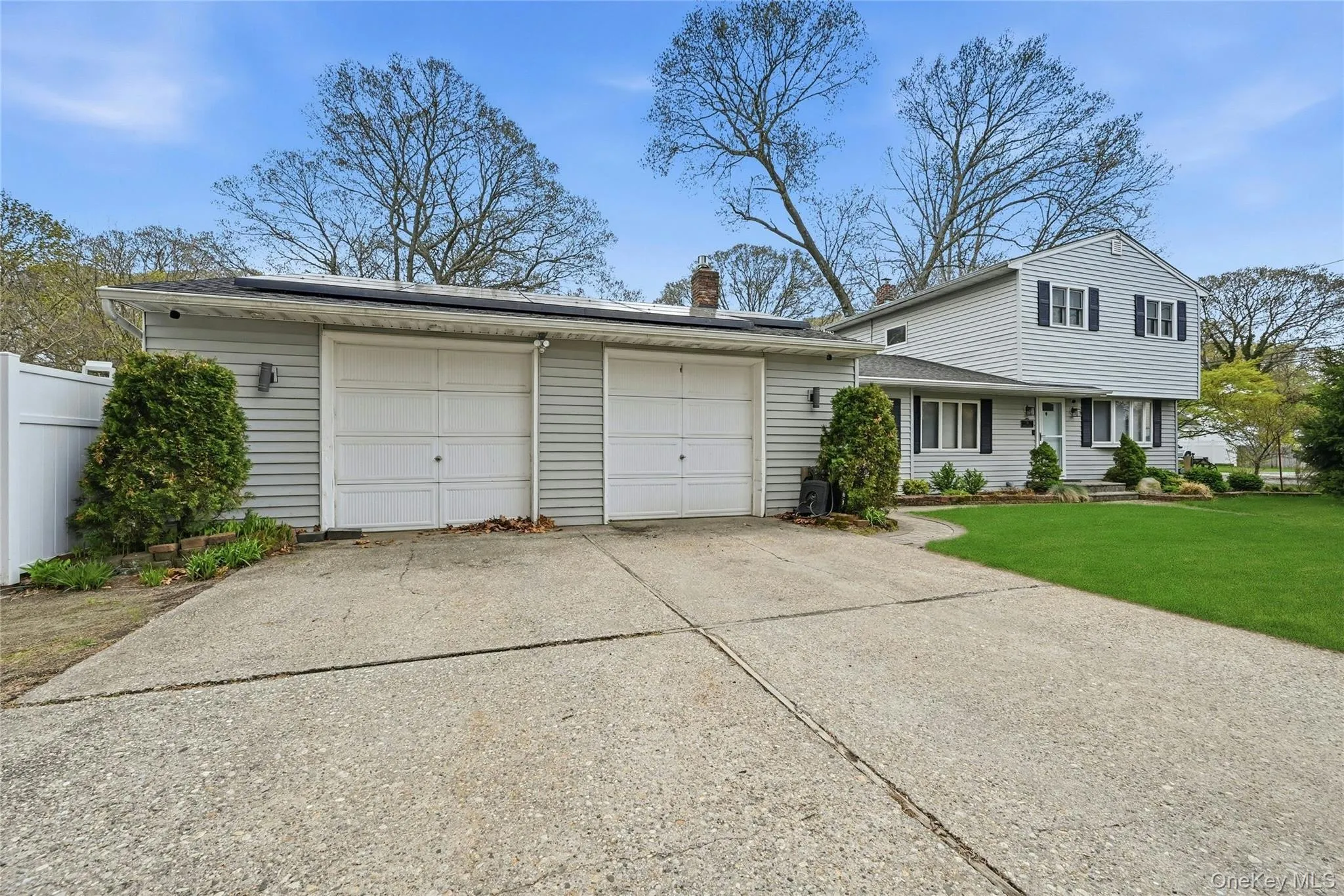 Beautiful Curb Appeal On Manicured Corner Property In A Lovely Neighborhood...The Home Offers An Oversized Two Car Garage & Concrete Driveway With Ample Room For 4+ Cars. Beautiful Curb Appeal On Manicured Corner Property In A Lovely Neighborhood...The Home Offers An Oversized Two Car Garage & Concrete Driveway With Ample Room For 4+ Cars.