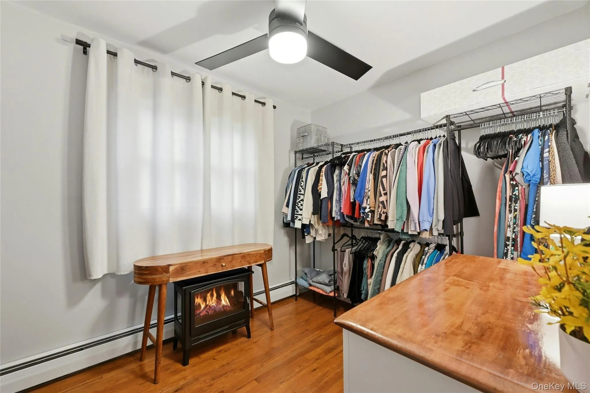 The Well Sized Third Bedroom (Currently Used As A Walk In Closet) Offers A Double Window For Natural Light, Hardwood Floors, Ceiling Fan, Ample Room For Furniture And A Good Sized Closet. The Well Sized Third Bedroom (Currently Used As A Walk In Closet) Offers A Double Window For Natural Light, Hardwood Floors, Ceiling Fan, Ample Room For Furniture And A Good Sized Closet.