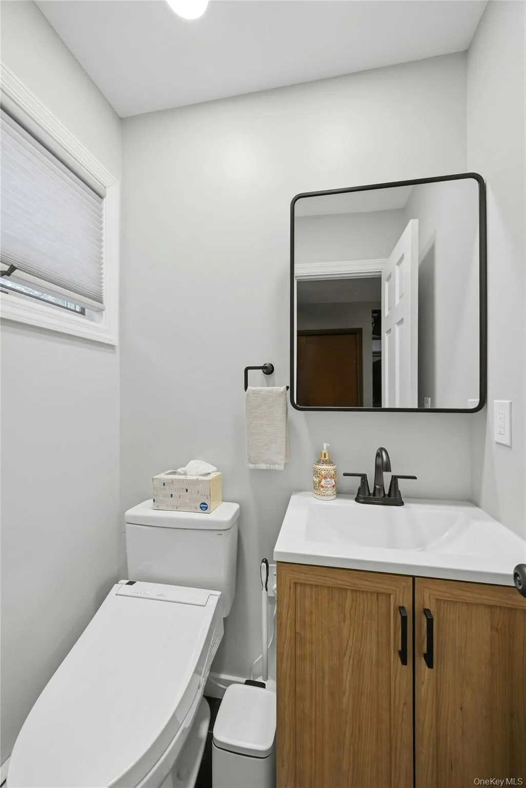 Off Of The Den/Family Room Is The Beautifully Renovated Half Bathroom/Powder Room With An Upgraded Vanity, All Upgraded Fixtures & Lovely Accent Ceramic Tiled Floor. Off Of The Den/Family Room Is The Beautifully Renovated Half Bathroom/Powder Room With An Upgraded Vanity, All Upgraded Fixtures & Lovely Accent Ceramic Tiled Floor.