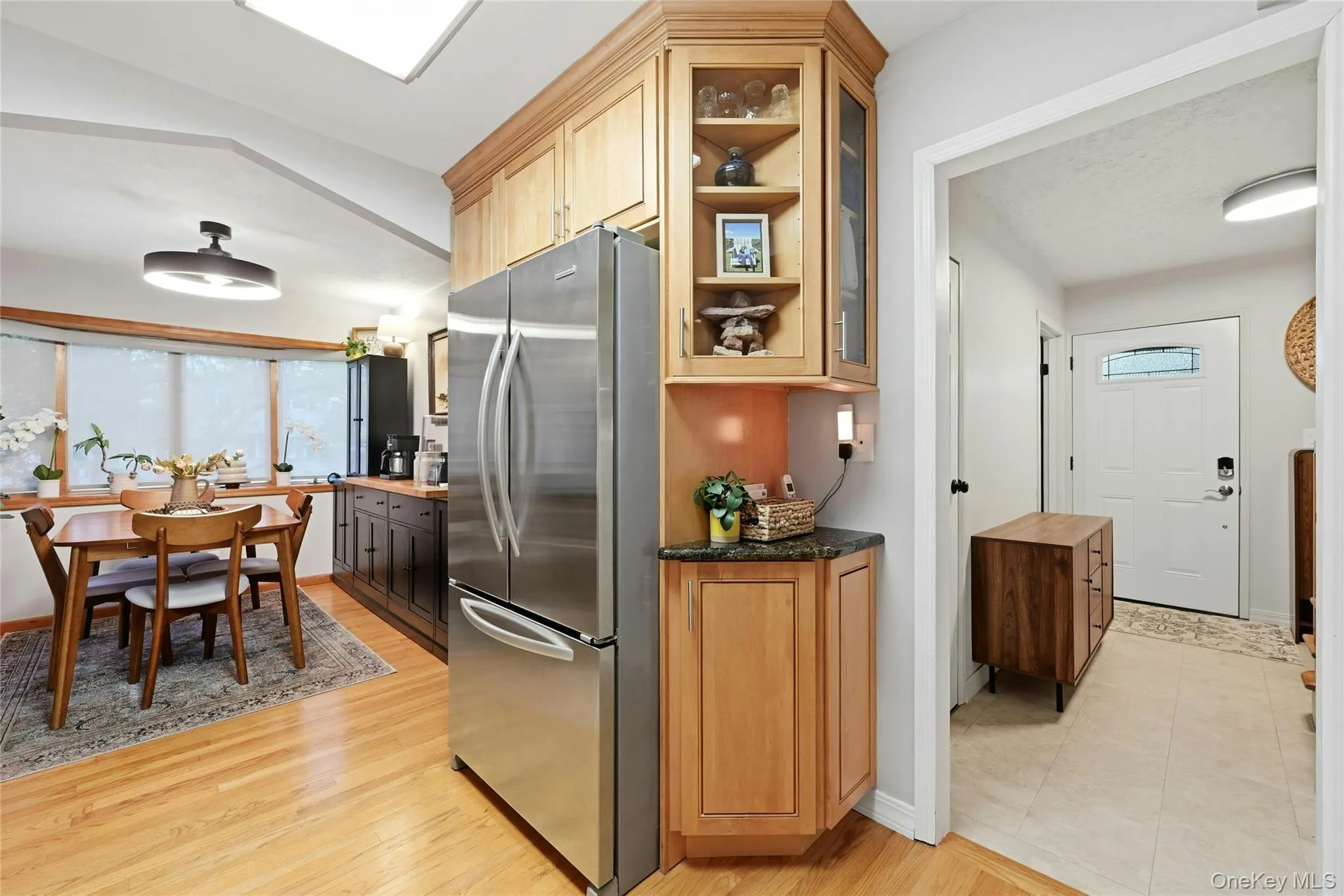 The Other Side Of The Kitchen Offers Custom Cabinetry With Built In Shelves And Beautiful Moldings, And A Stainless Steel French Door Refrigerator With Bottom Freezer. The Other Side Of The Kitchen Offers Custom Cabinetry With Built In Shelves And Beautiful Moldings, And A Stainless Steel French Door Refrigerator With Bottom Freezer.