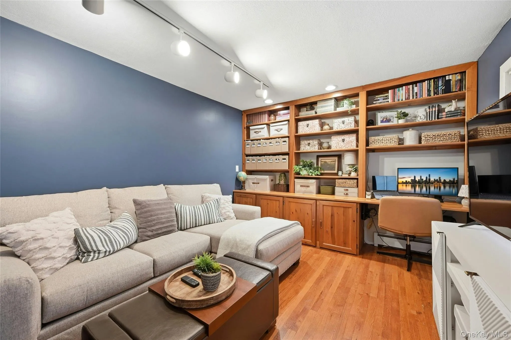 Off Of The Entrance Foyer Is The Warm & Inviting Formal Living Room/Sitting Room With A Wall Of Beautiful Custom Built Bookshelves & Desk, Hardwood Floors, A Large Bay Window For Natural Light & Ample Room For Furniture. Off Of The Entrance Foyer Is The Warm & Inviting Formal Living Room/Sitting Room With A Wall Of Beautiful Custom Built Bookshelves & Desk, Hardwood Floors, A Large Bay Window For Natural Light & Ample Room For Furniture.