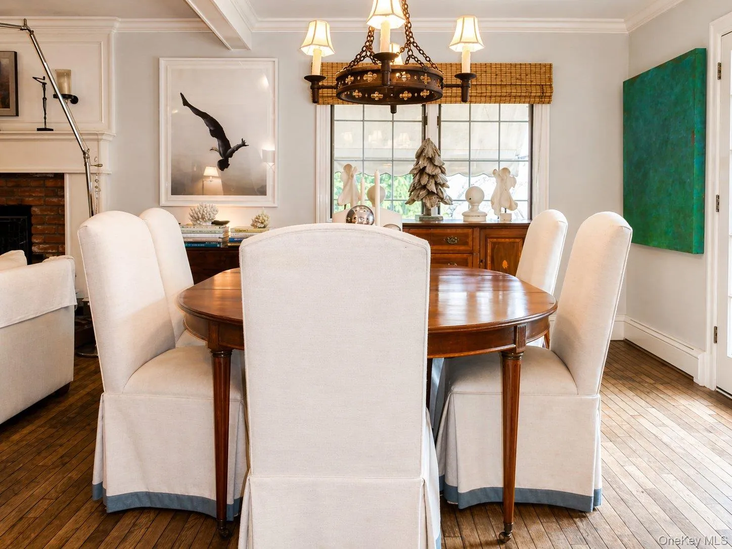 Dining room with hardwood floors and natural light, positioned for easy indoor-outdoor entertaining Dining room with hardwood floors and natural light, positioned for easy indoor-outdoor entertaining