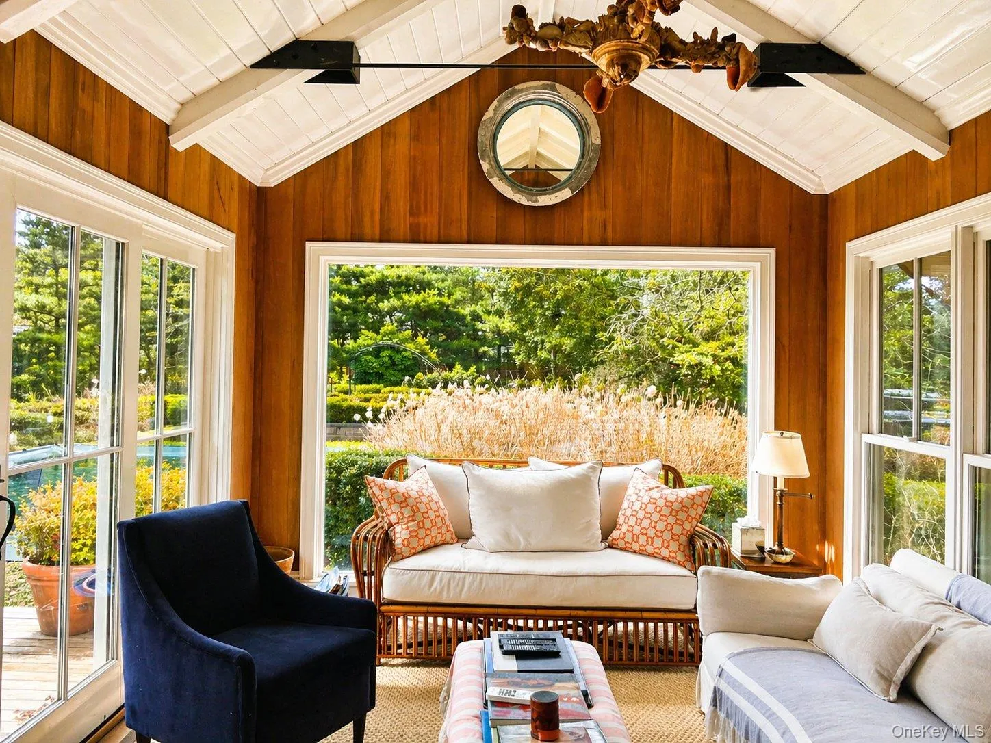 Sun-filled sunroom with vaulted ceiling, oversized windows and views of the grounds. Sun-filled sunroom with vaulted ceiling, oversized windows and views of the grounds.