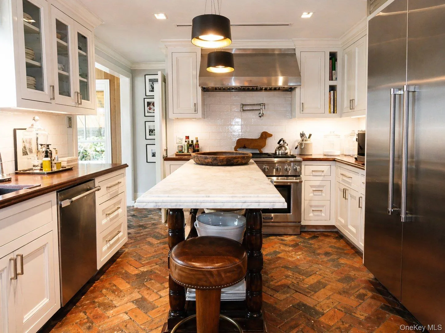 Chef's kitchen with center island, extensive cabinetry and premium Thermador appliances. Chef's kitchen with center island, extensive cabinetry and premium Thermador appliances.