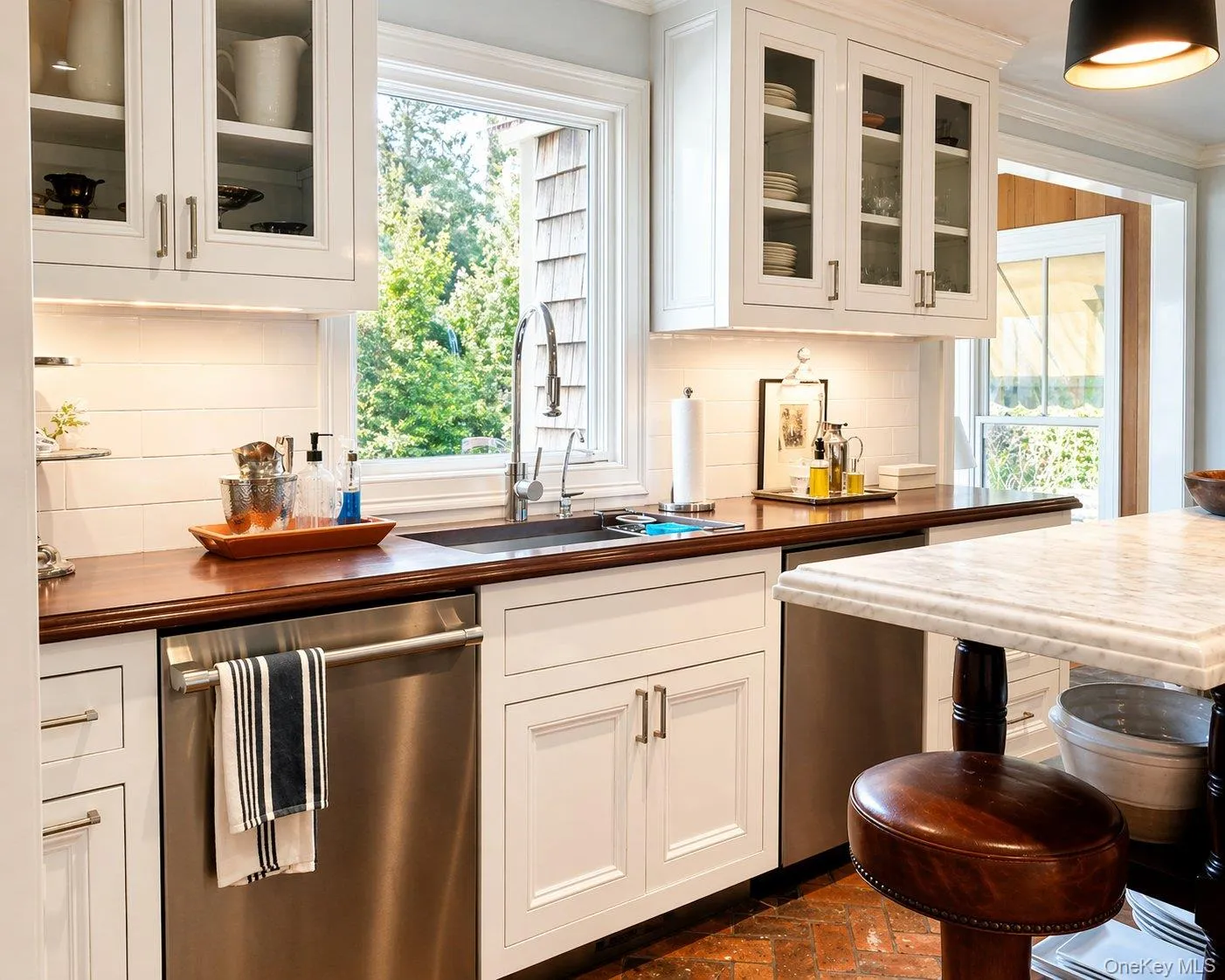 Additional kitchen view highlighting the cabinetry, workspace and dual dishwashers. Additional kitchen view highlighting the cabinetry, workspace and dual dishwashers.
