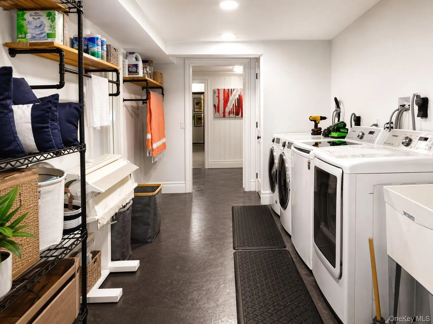 Dedicated lower-level laundry area with extensive utility and storage space. Dedicated lower-level laundry area with extensive utility and storage space.