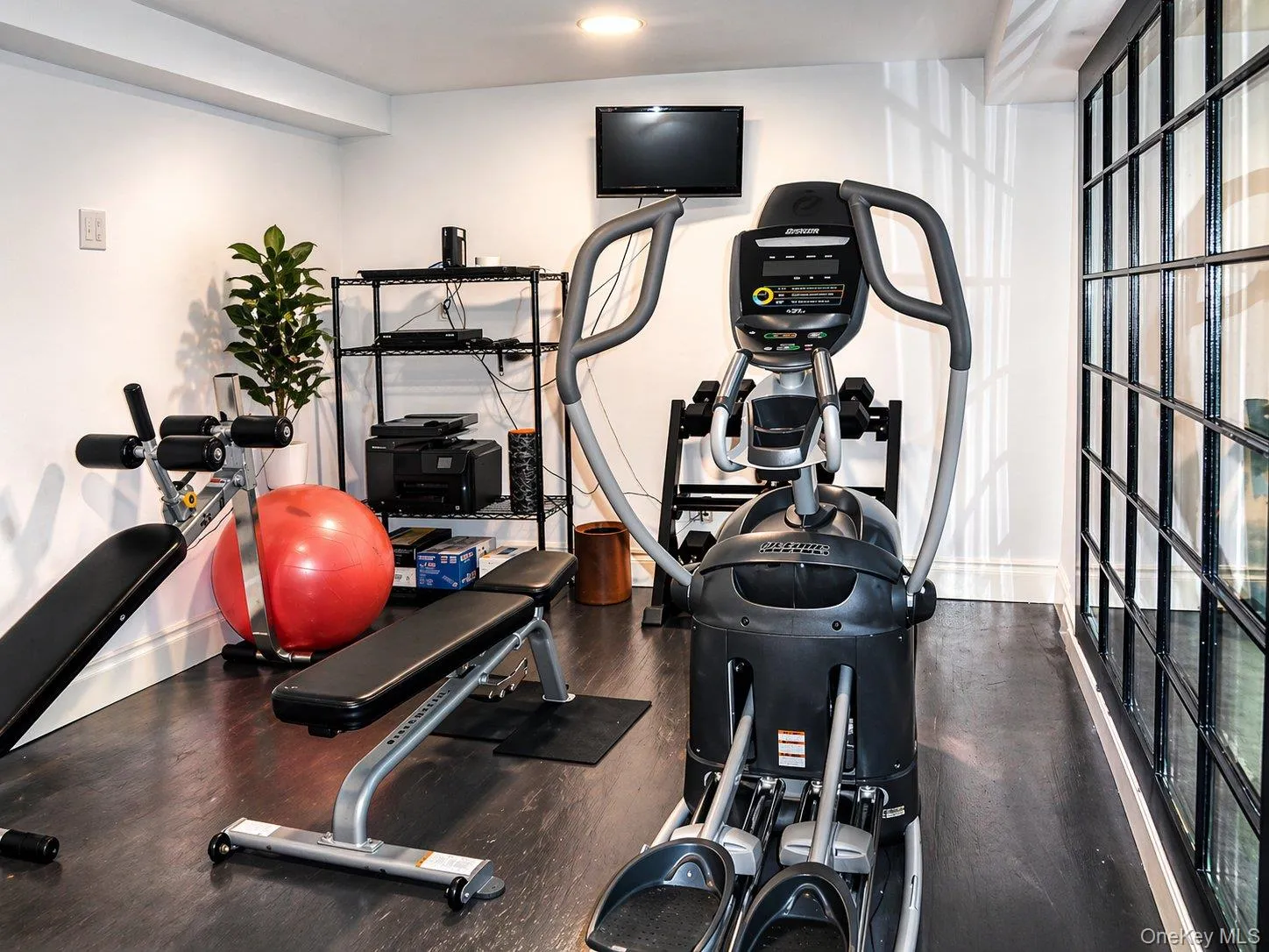 Finished lower-level exercise area providing flexible space for an at-home fitness setup. Finished lower-level exercise area providing flexible space for an at-home fitness setup.