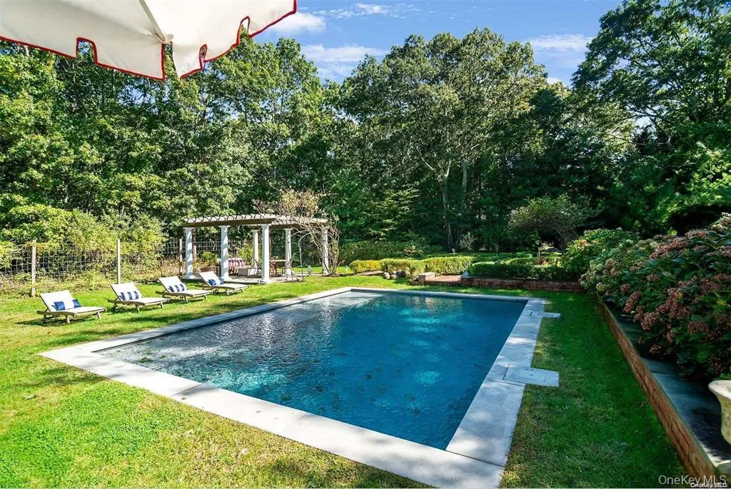 Private pool setting surrounded by lawn, established landscaping and pergola. Private pool setting surrounded by lawn, established landscaping and pergola.