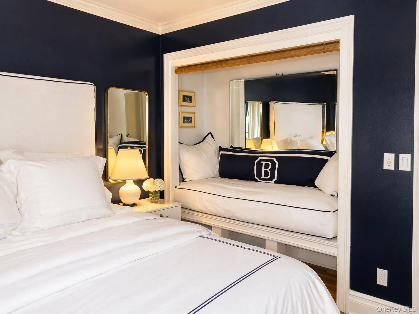 Additional bedroom view highlighting the distinctive built-in alcove and mirrored detail. Additional bedroom view highlighting the distinctive built-in alcove and mirrored detail.