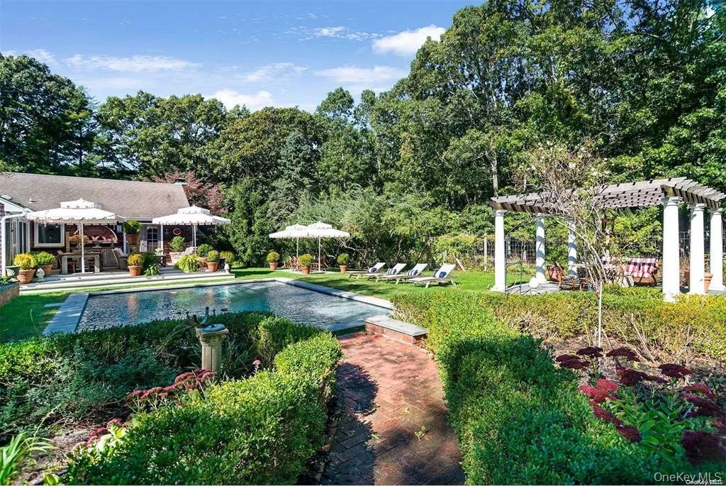 Pool and landscaped gardens with pergola and multiple areas for outdoor enjoyment. Pool and landscaped gardens with pergola and multiple areas for outdoor enjoyment.