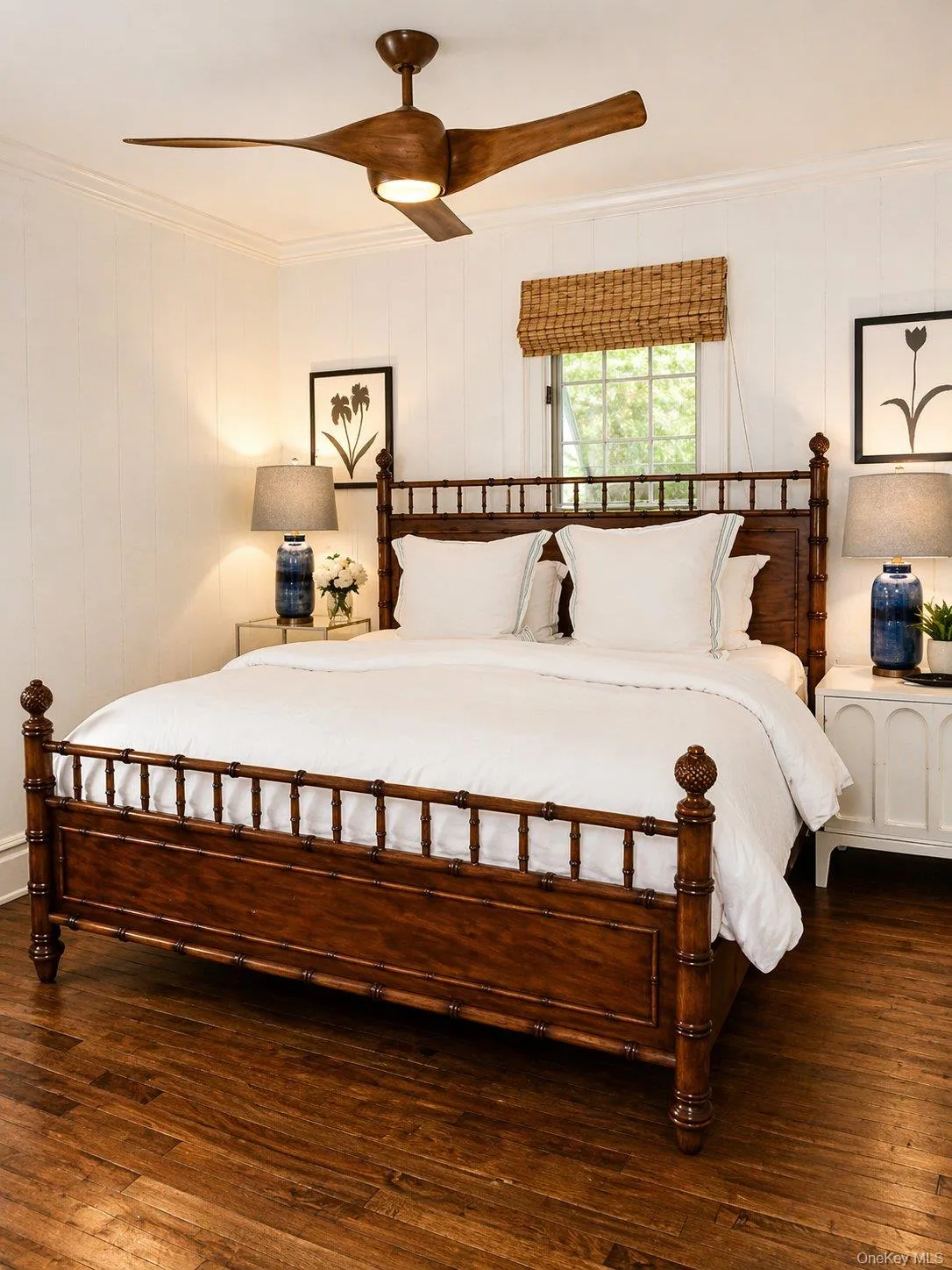 Bedroom with hardwood floors, natural light and classic Southampton styling. Bedroom with hardwood floors, natural light and classic Southampton styling.