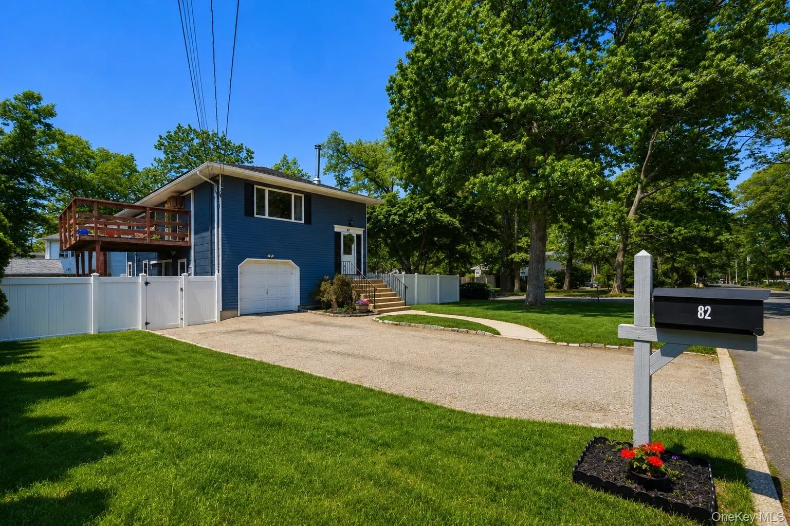 Contemporary blue siding exterior with a white garage door Contemporary blue siding exterior with a white garage door