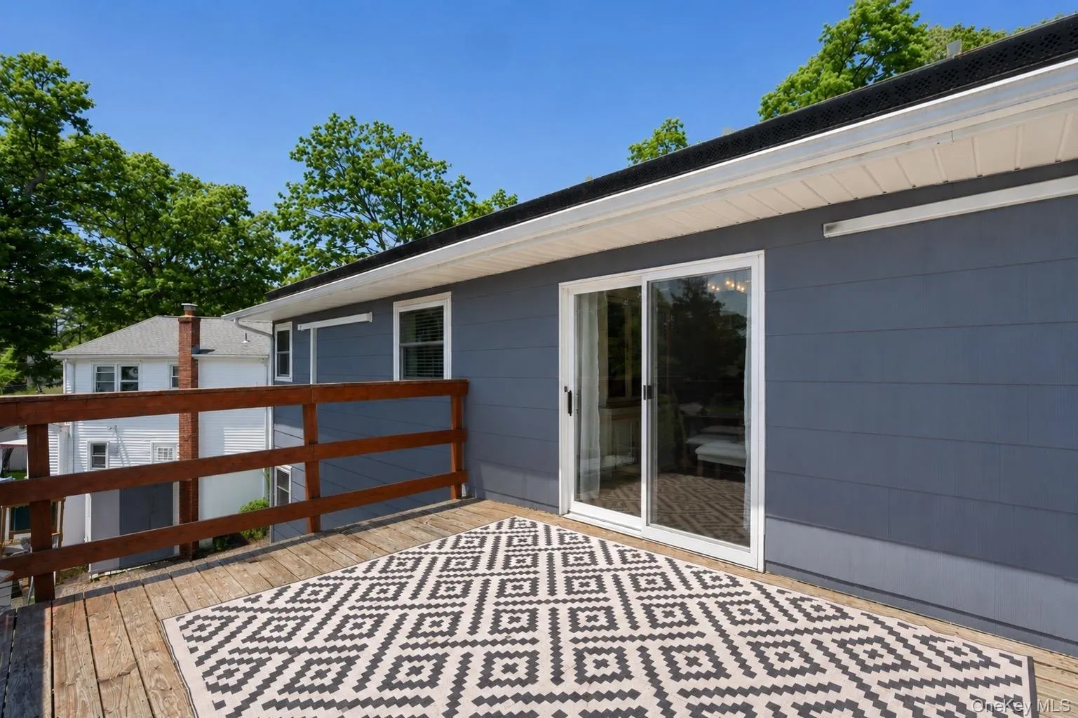 Sliding Doors lead outside to a large Deck Sliding Doors lead outside to a large Deck
