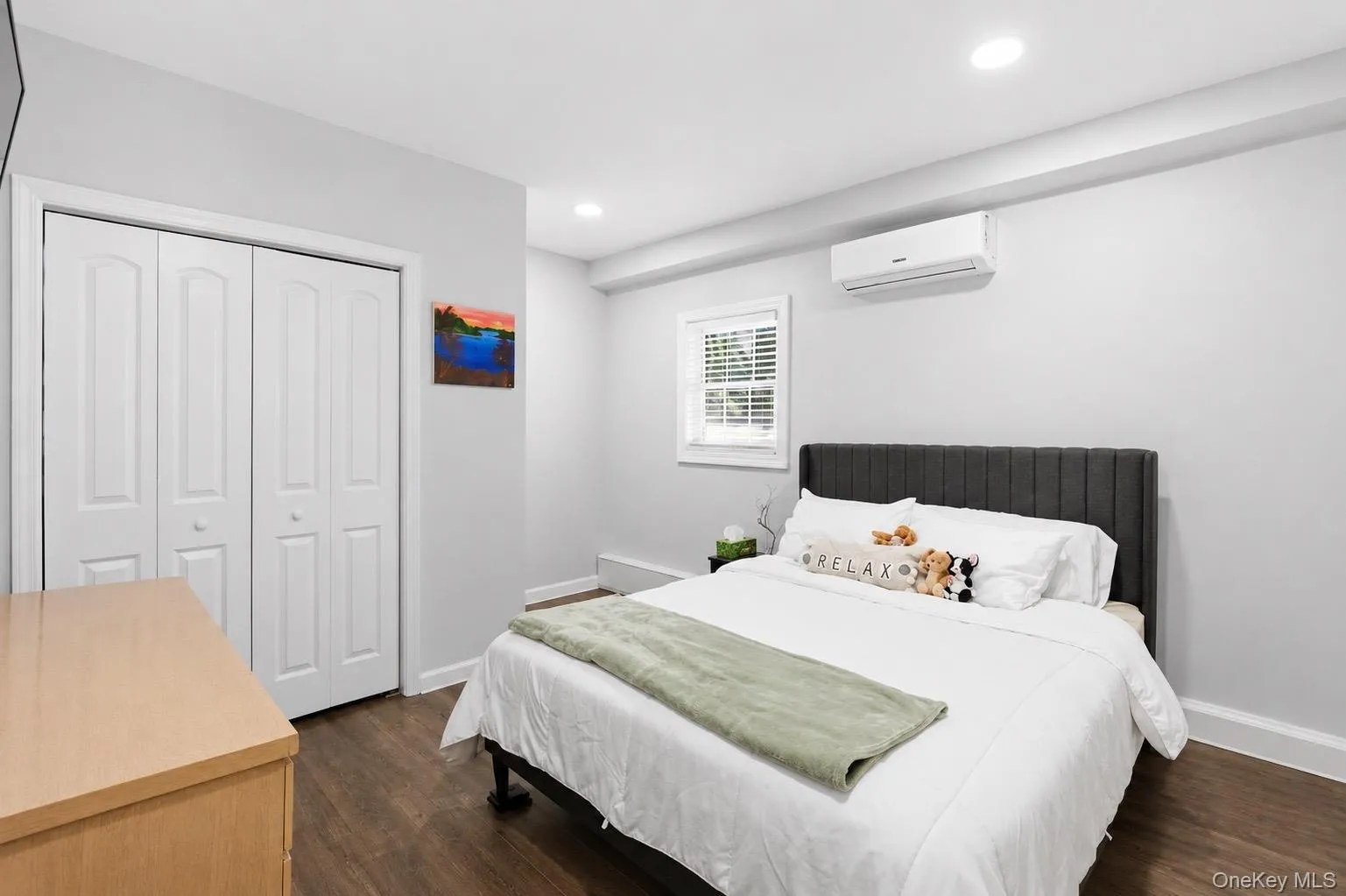 Bright interior space featuring wood-finish flooring, recessed lighting, mini split and generous closet space Bright interior space featuring wood-finish flooring, recessed lighting, mini split and generous closet space