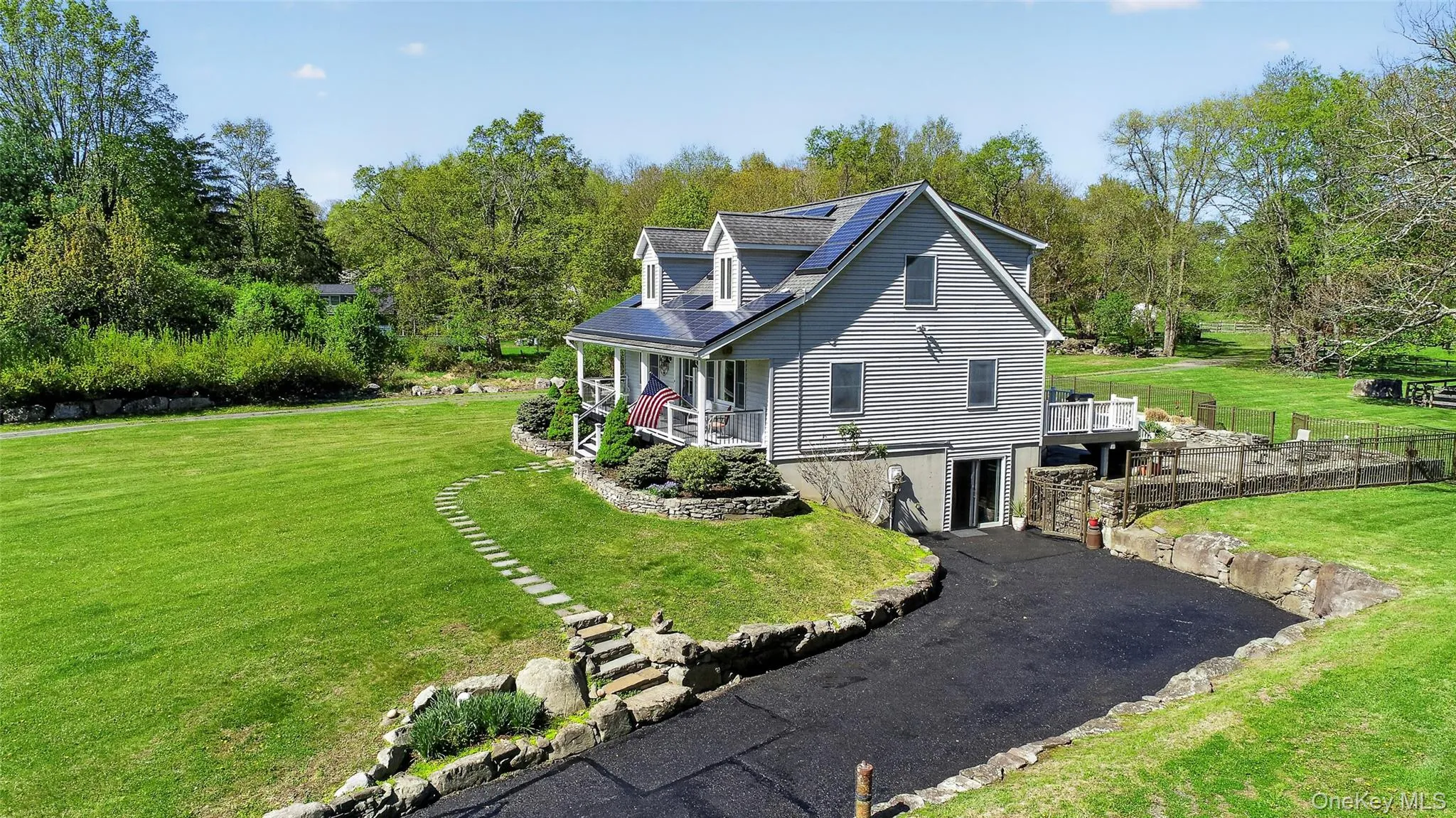As you approach, take note of the stone walls, established gardens, and the fresh sealcoat on the driveway. As you approach, take note of the stone walls, established gardens, and the fresh sealcoat on the driveway.