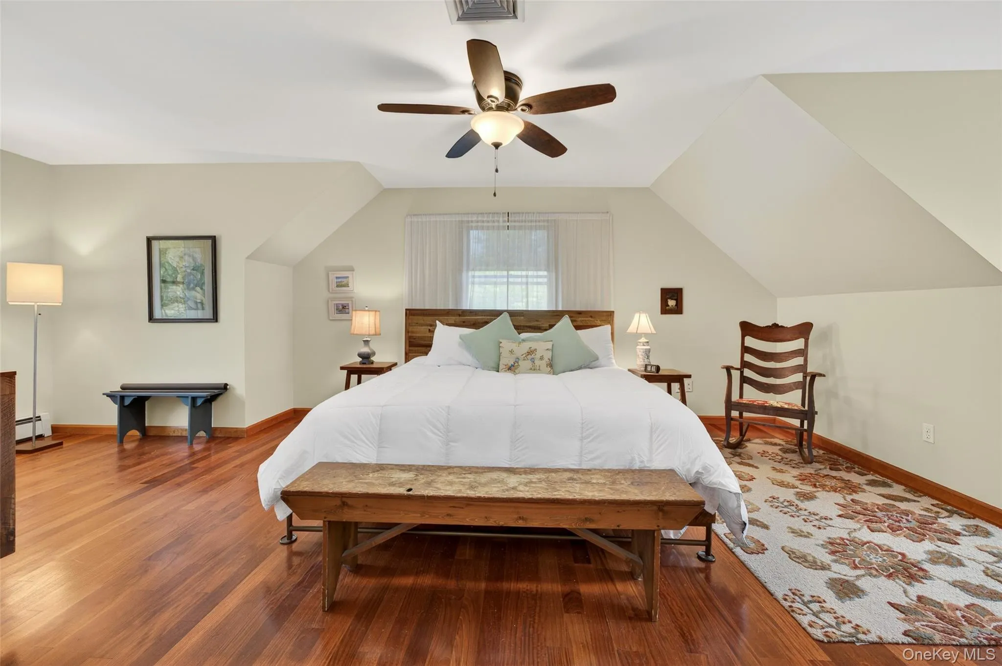 A stunning primary bedroom with Brazilian cherry floors A stunning primary bedroom with Brazilian cherry floors