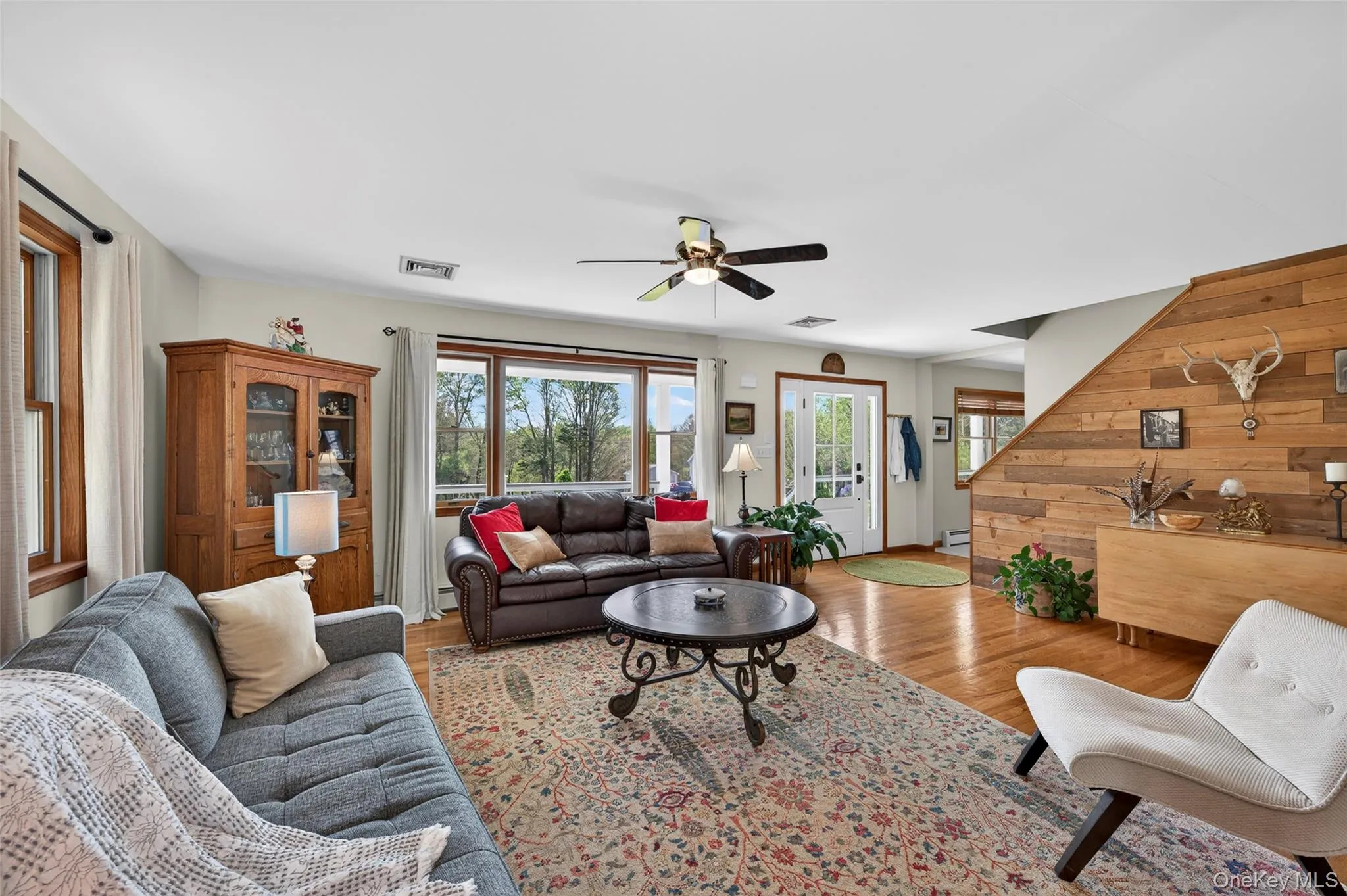 The living room is a comfortable space with attractive touches like the cedar wall The living room is a comfortable space with attractive touches like the cedar wall