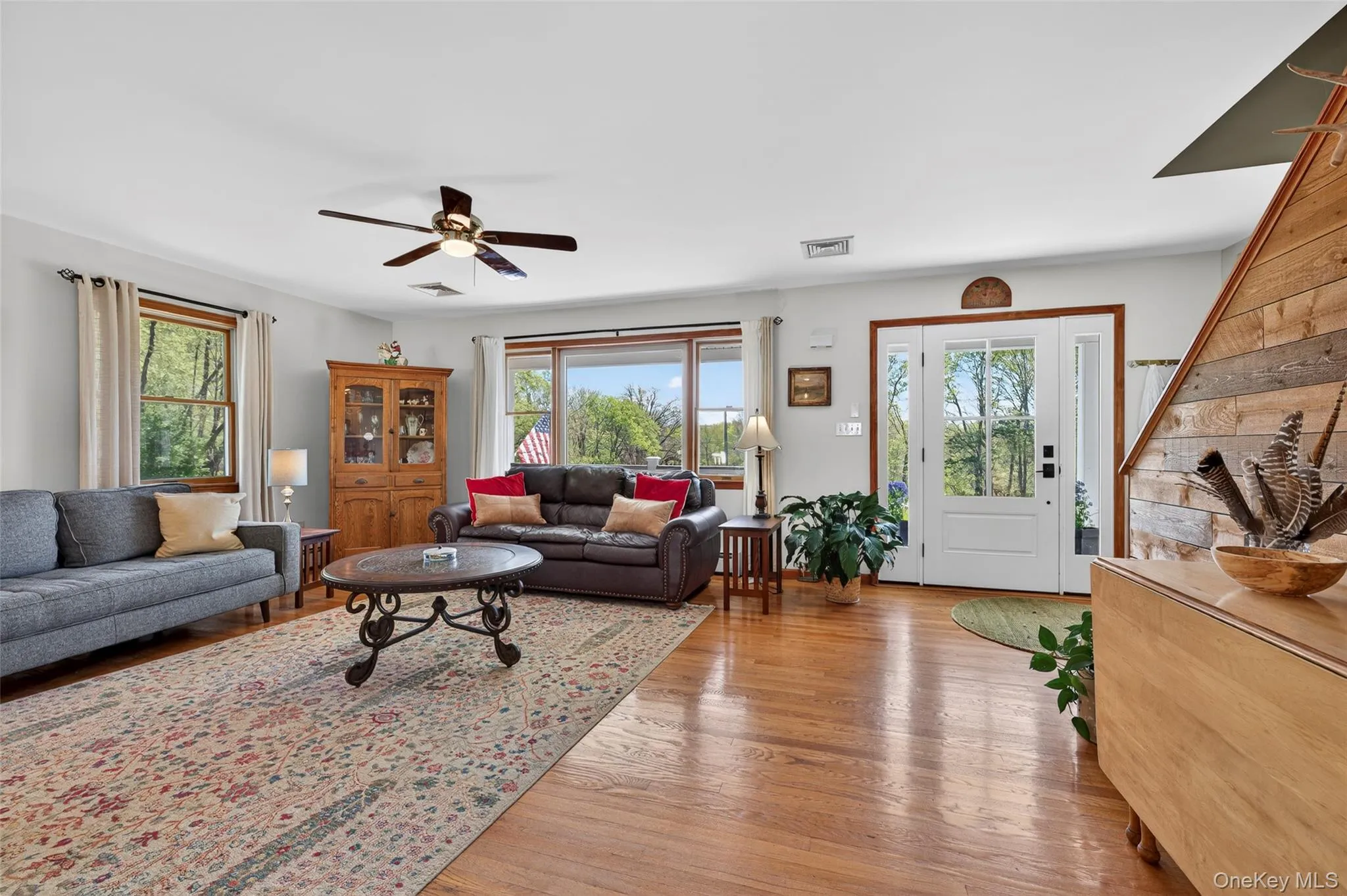 Step through the front threshold into an open floor plan with original oak floors and drenched in morning light Step through the front threshold into an open floor plan with original oak floors and drenched in morning light