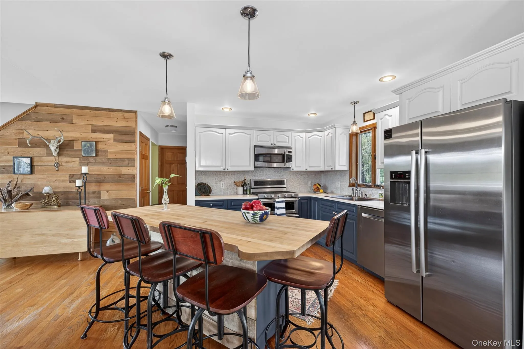 The seated butcher block island is large enough for a crowd The seated butcher block island is large enough for a crowd