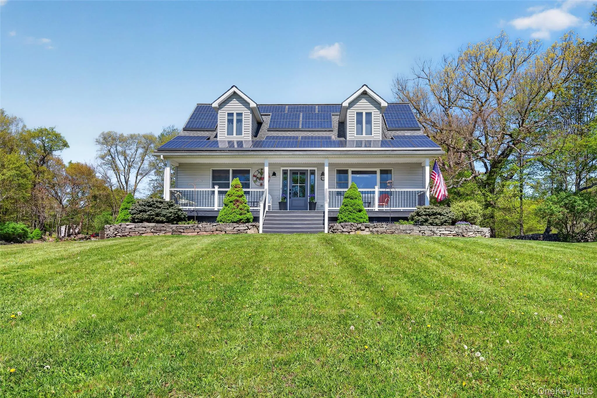 Classic and refined Cape Cod with a welcoming, wide front porch Classic and refined Cape Cod with a welcoming, wide front porch