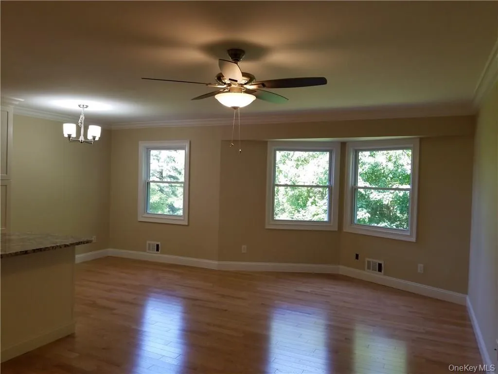 Shot of open floor plan between living room and dining room area Shot of open floor plan between living room and dining room area