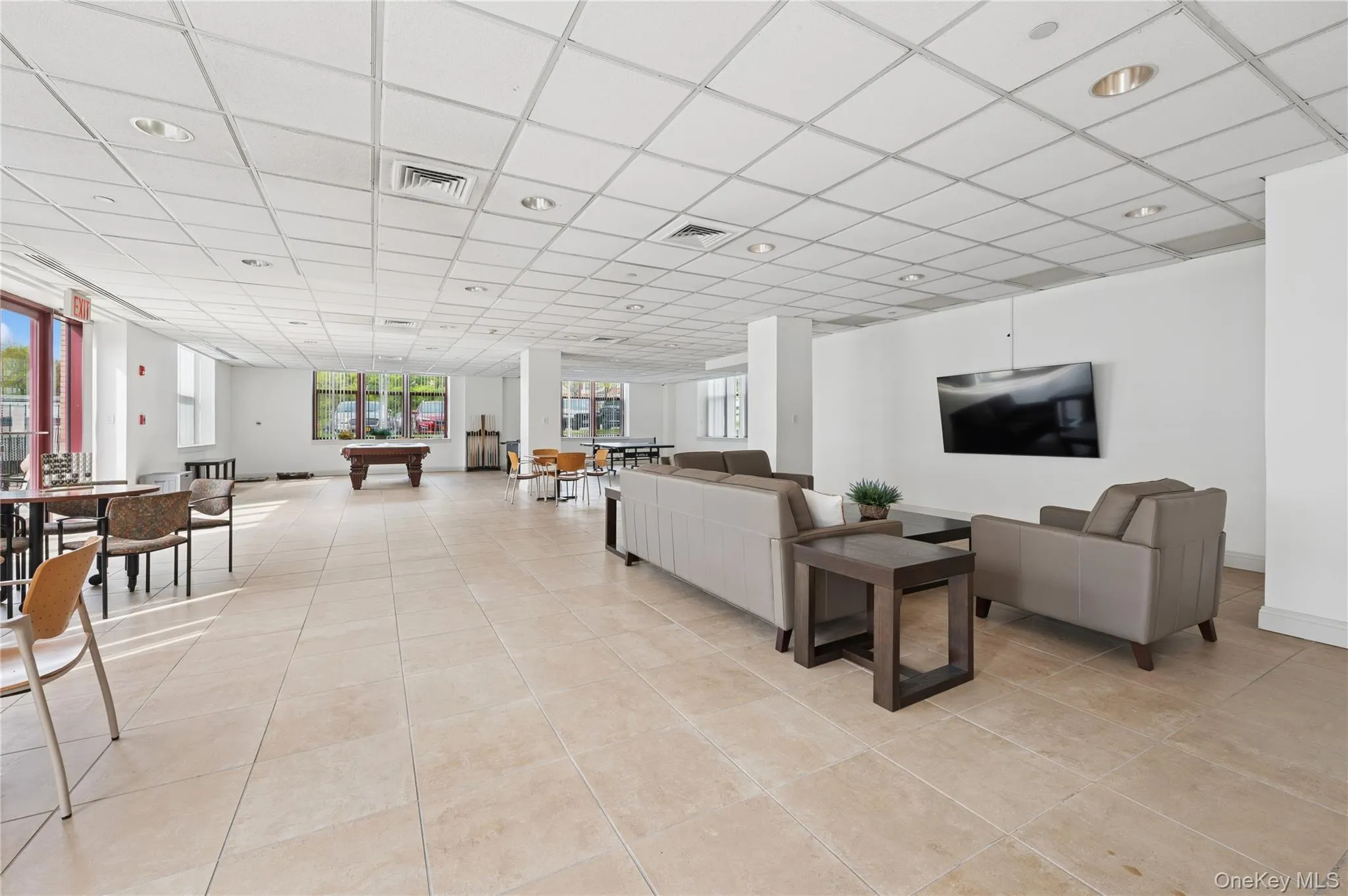 Recreation room with access to side patio. Recreation room with access to side patio.