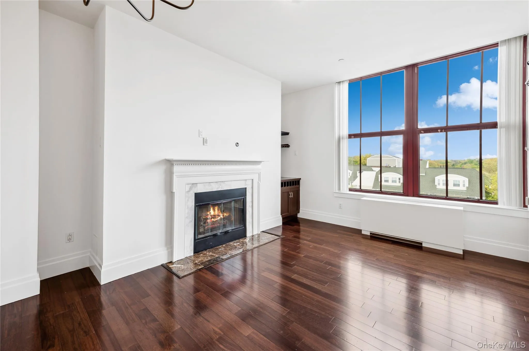 Living room with over-sized windows and 13' ceilings. Living room with over-sized windows and 13' ceilings.