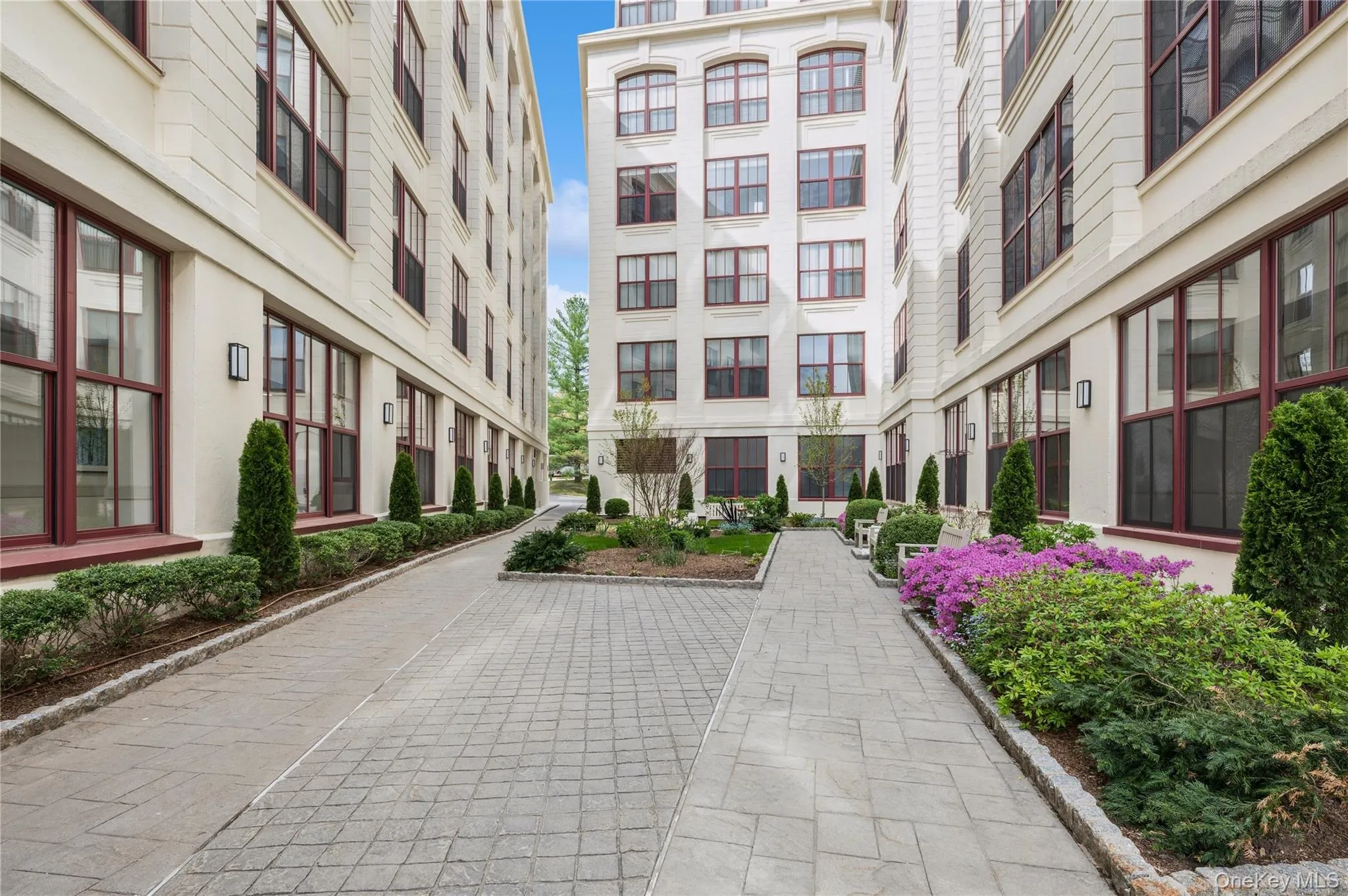 Beautifully landscaped courtyard view between the two buildings. Beautifully landscaped courtyard view between the two buildings.