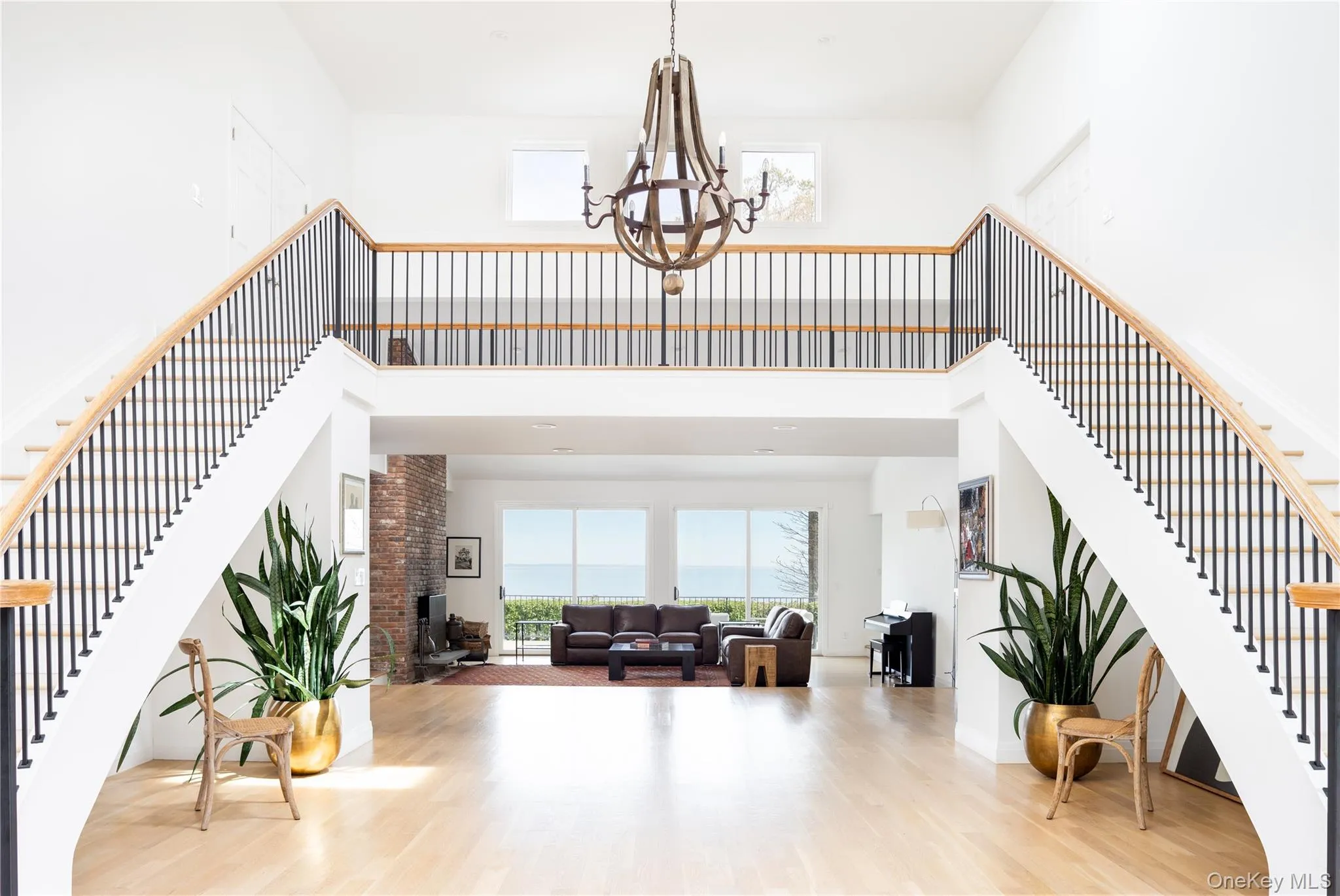 Front entry hall with double staircase and catwalk Front entry hall with double staircase and catwalk