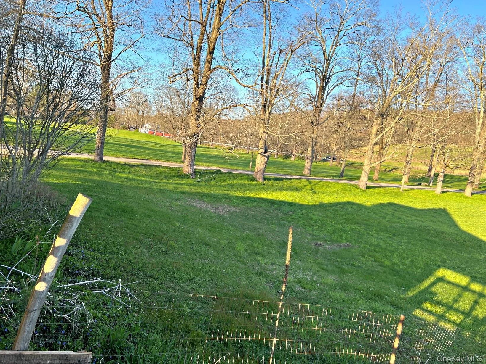 View of green lawn with a view of countryside View of green lawn with a view of countryside