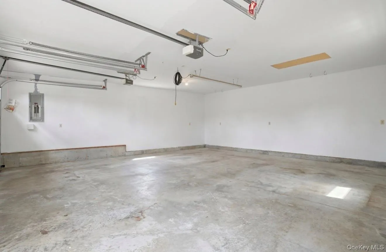 2 car garage. Staged empty for your imagination. Fully insulated. Electric charging station. 2 car garage. Staged empty for your imagination. Fully insulated. Electric charging station.