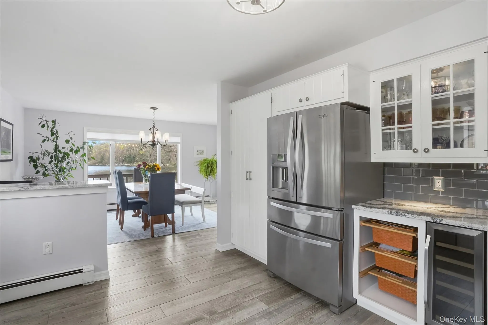 Doble door GE refrigerator, under counter storage baskets, wine cooler. Doble door GE refrigerator, under counter storage baskets, wine cooler.