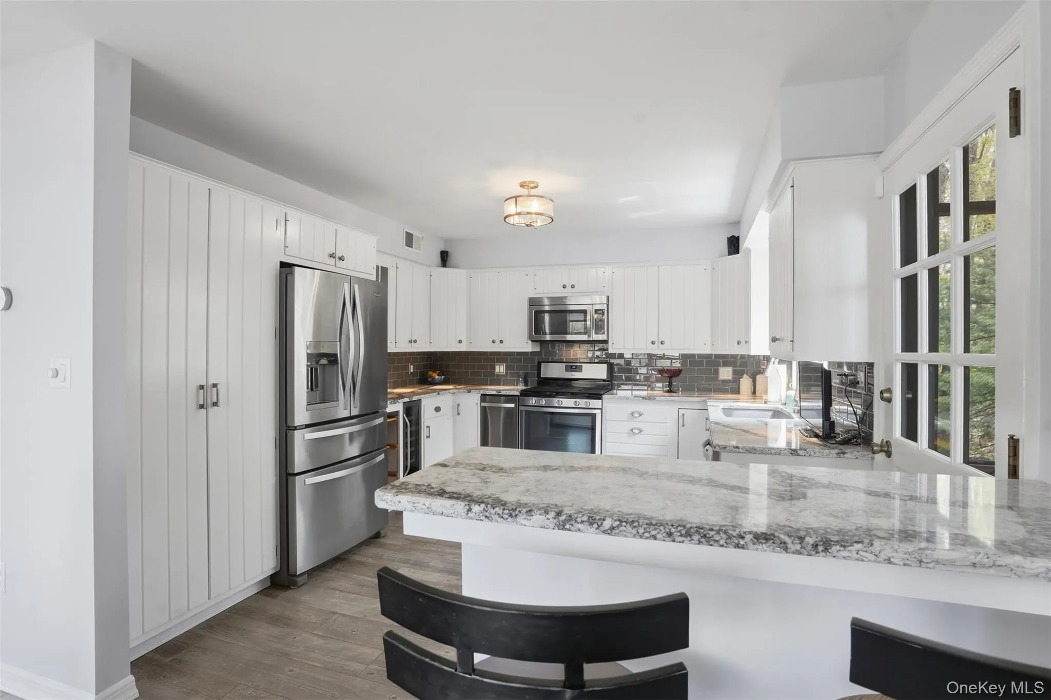 Wood cabinetry. Granit CT. S/S GE appliances. Gas stove, dishwasher, microwave, double door refrigerator. Wood cabinetry. Granit CT. S/S GE appliances. Gas stove, dishwasher, microwave, double door refrigerator.