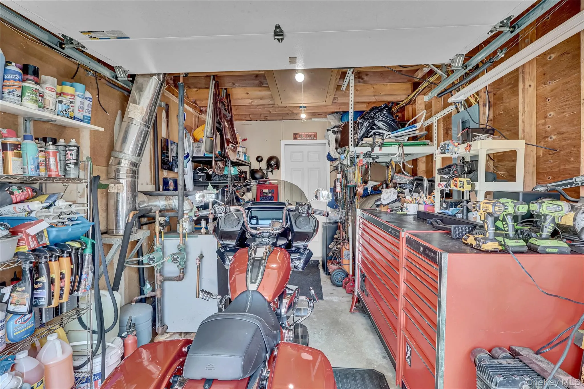 Attached garage houses the oil tank and heating system Attached garage houses the oil tank and heating system