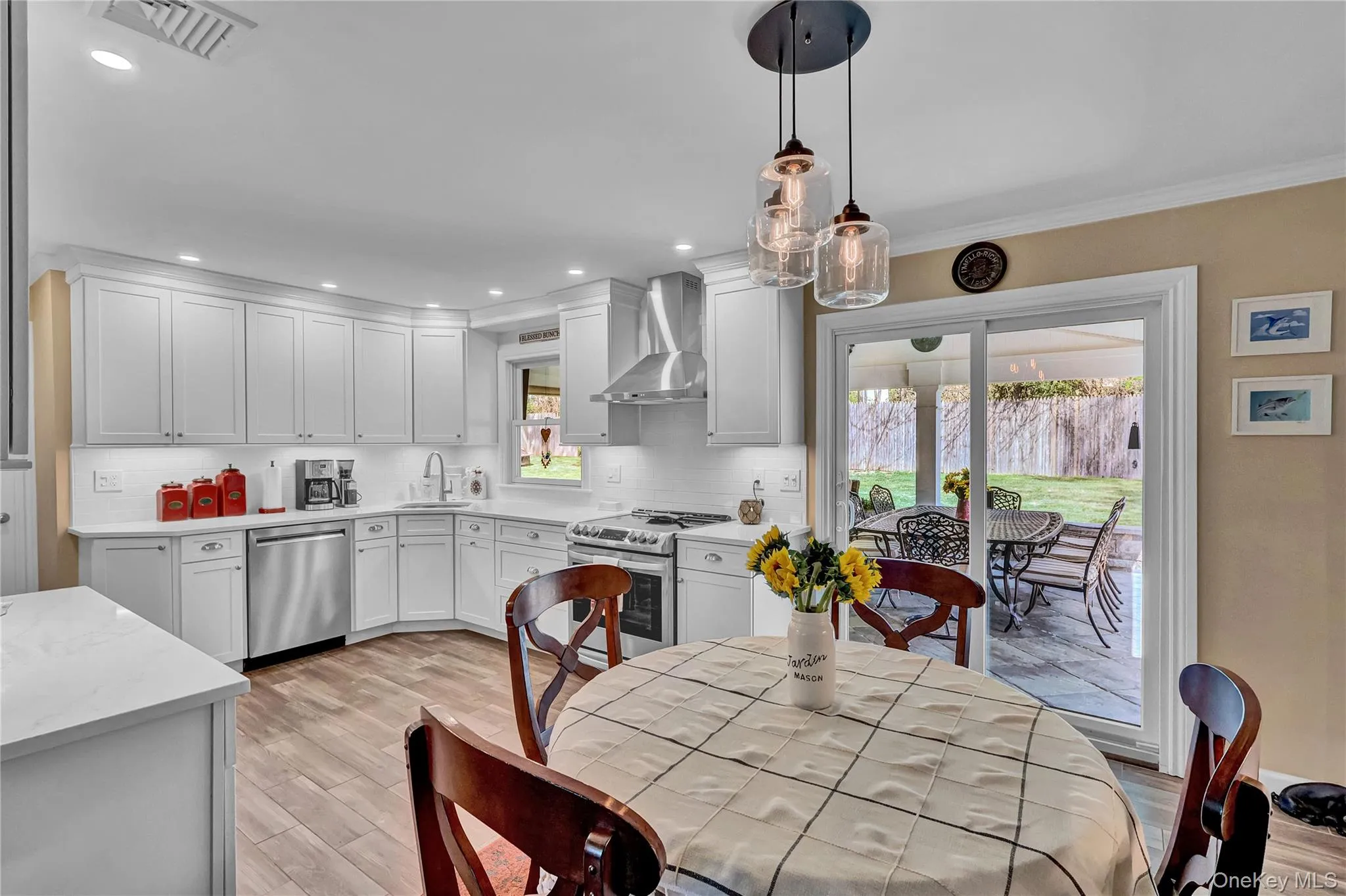 Large & bright eat-in kitchen with patio sliders to covered patio Large & bright eat-in kitchen with patio sliders to covered patio