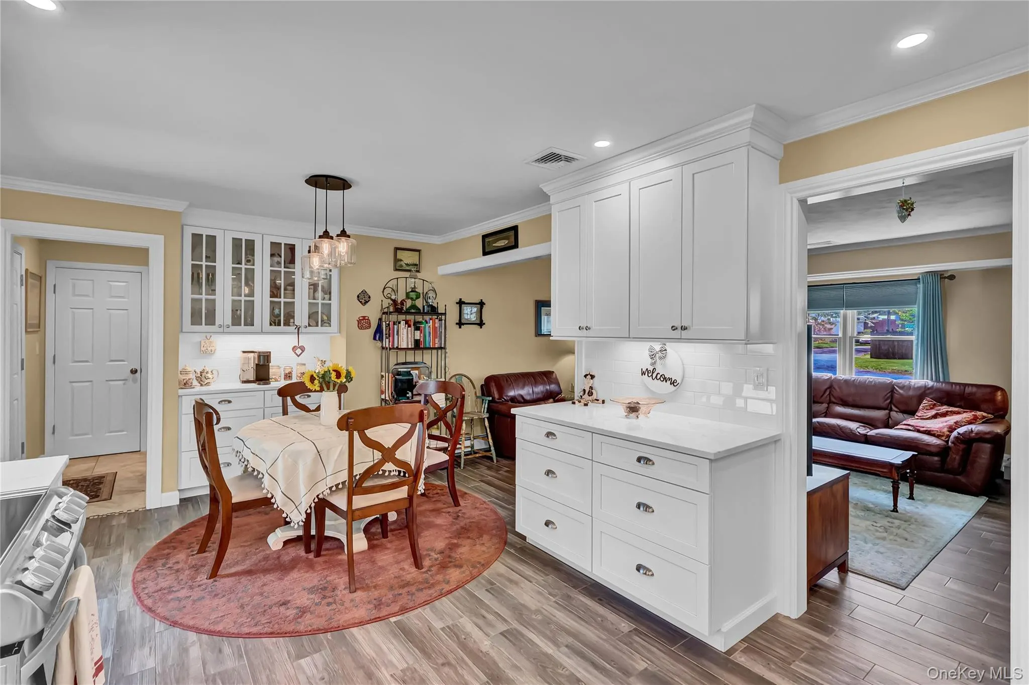 The gorgeous wood look tile flows from the living room to the kitchen The gorgeous wood look tile flows from the living room to the kitchen