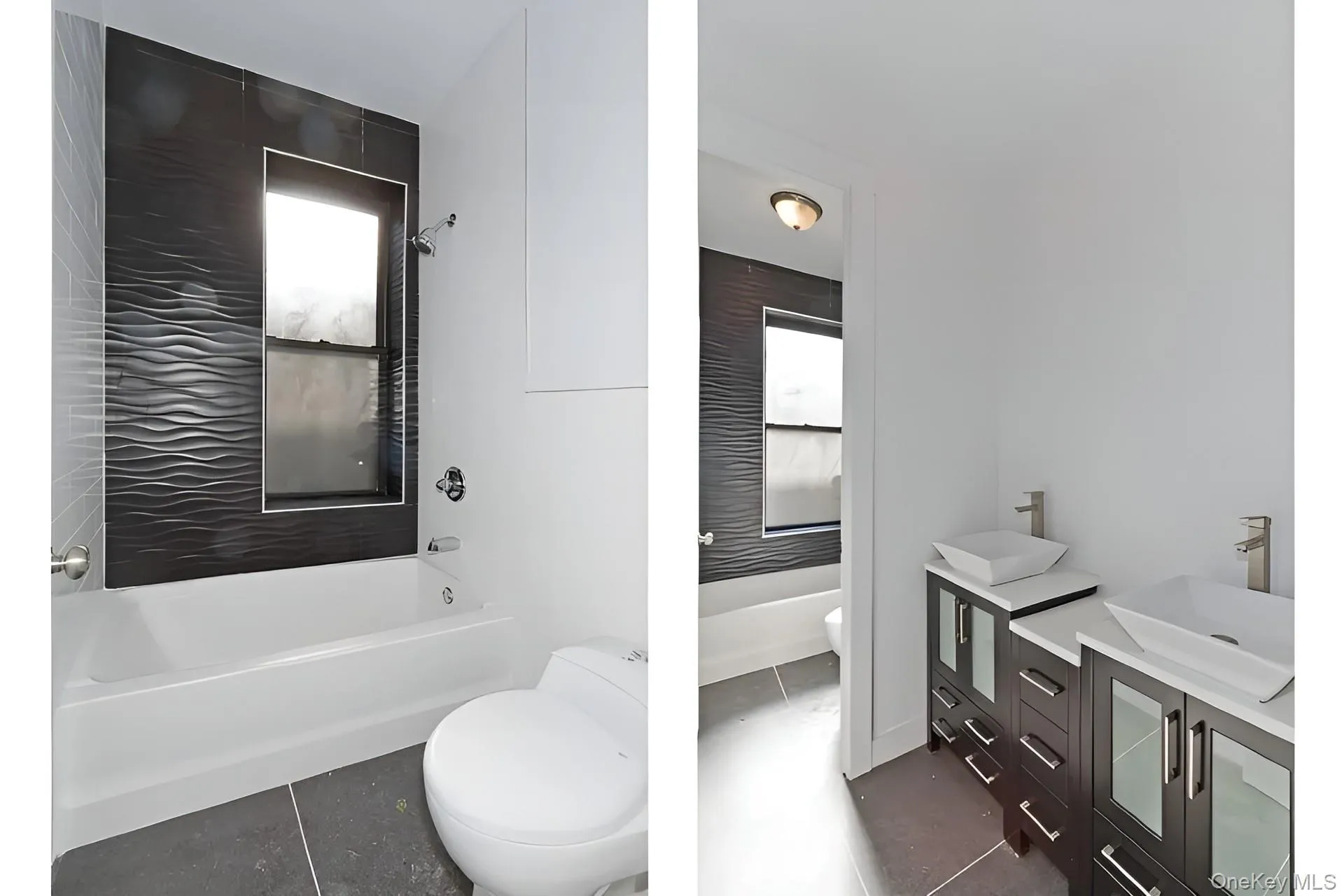 Contemporary bathroom featuring a white soaking tub, dark textured tile shower surround, and a coordinating dark tile floor Contemporary bathroom featuring a white soaking tub, dark textured tile shower surround, and a coordinating dark tile floor