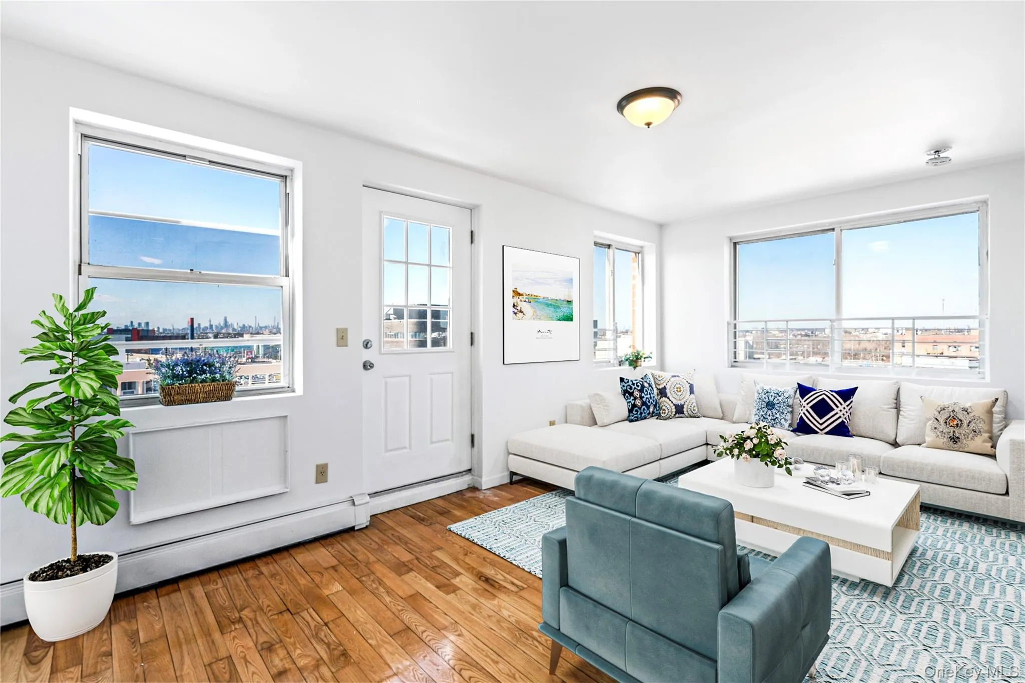 Virtual Staged Living area with healthy amount of natural light and hardwood / wood-style flooring Virtual Staged Living area with healthy amount of natural light and hardwood / wood-style flooring
