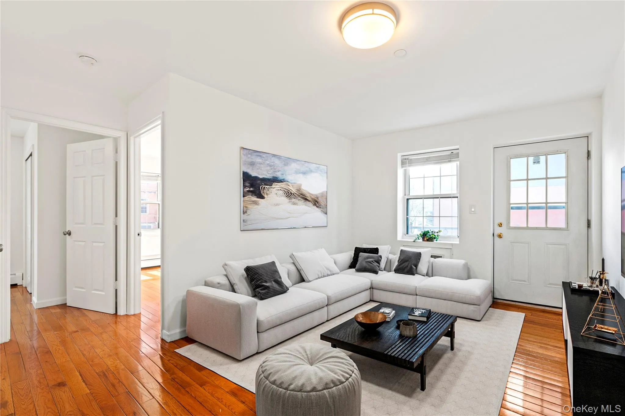 Virtual Staged Living area with light wood-type flooring and baseboards Virtual Staged Living area with light wood-type flooring and baseboards