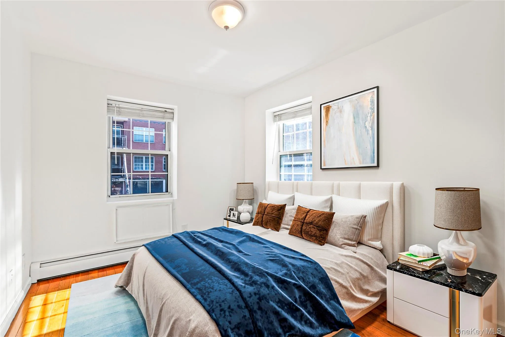 Virtual Staged Bedroom with a baseboard heating unit and wood finished floors Virtual Staged Bedroom with a baseboard heating unit and wood finished floors