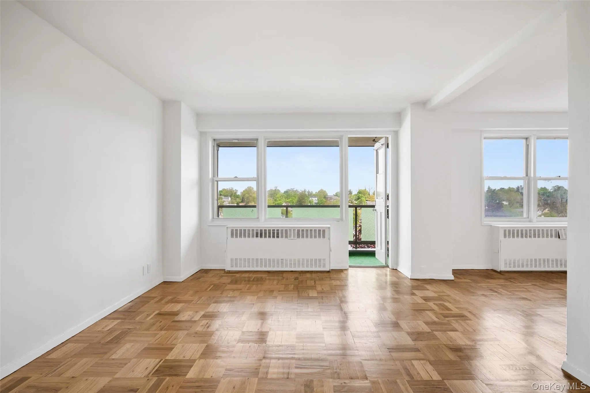 Bright interior with wood-finish parquet flooring Bright interior with wood-finish parquet flooring