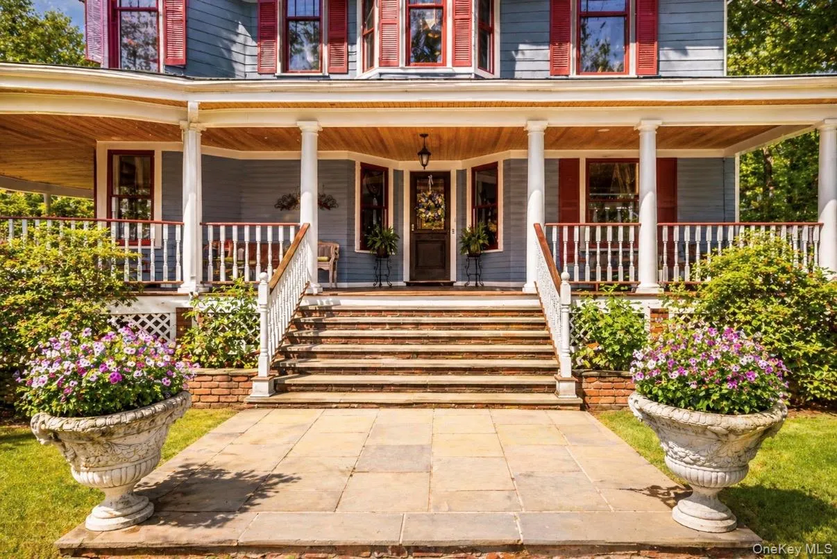 Doorway to property featuring wrap around porch Doorway to property featuring wrap around porch