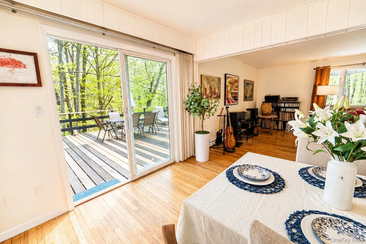 The dining room features sliders that lead out to a spacious, expansive deck. The dining room features sliders that lead out to a spacious, expansive deck.