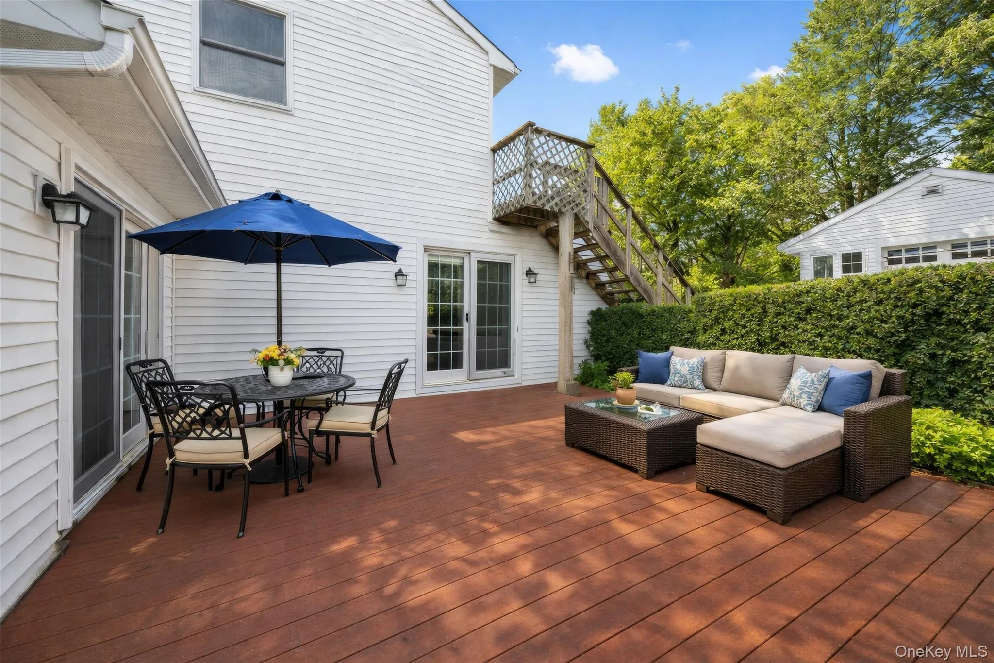 Spacious outdoor deck featuring rich wood-finish flooring Spacious outdoor deck featuring rich wood-finish flooring