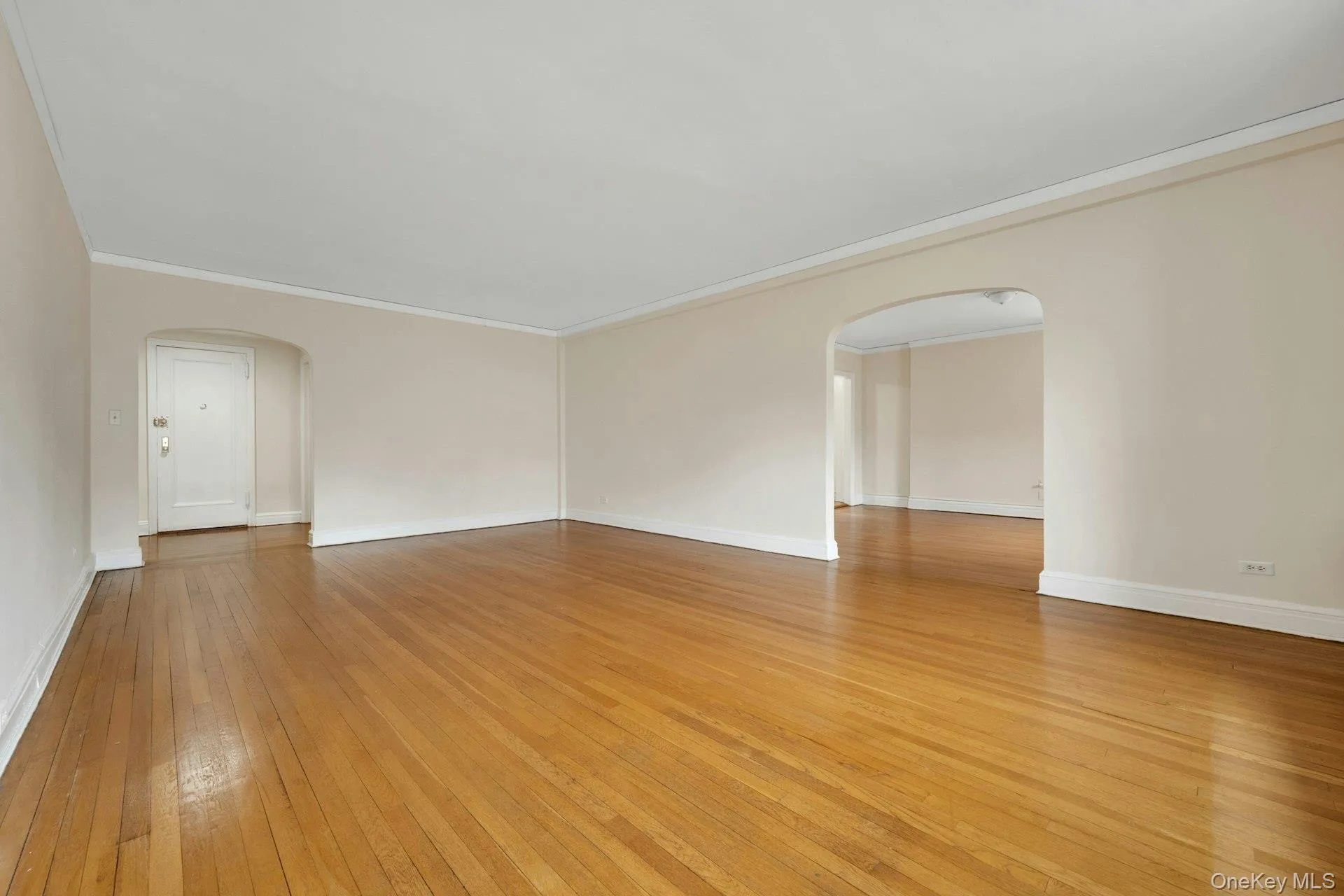Living Room with archway to Formal Dining Room Living Room with archway to Formal Dining Room