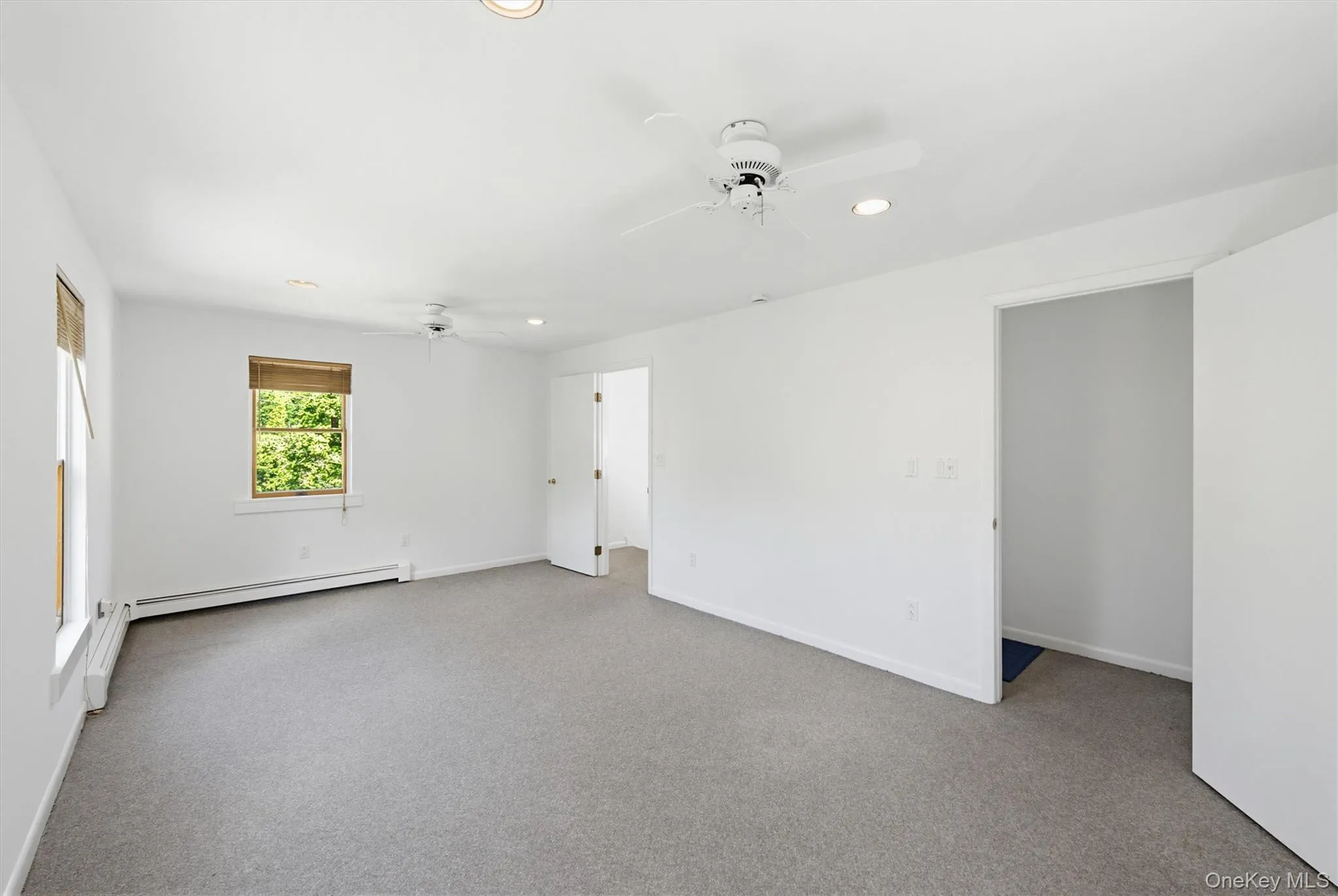 The upstairs bedroom features two separate entrances from the hallway, offering flexible layout options for a variety of uses. The upstairs bedroom features two separate entrances from the hallway, offering flexible layout options for a variety of uses.