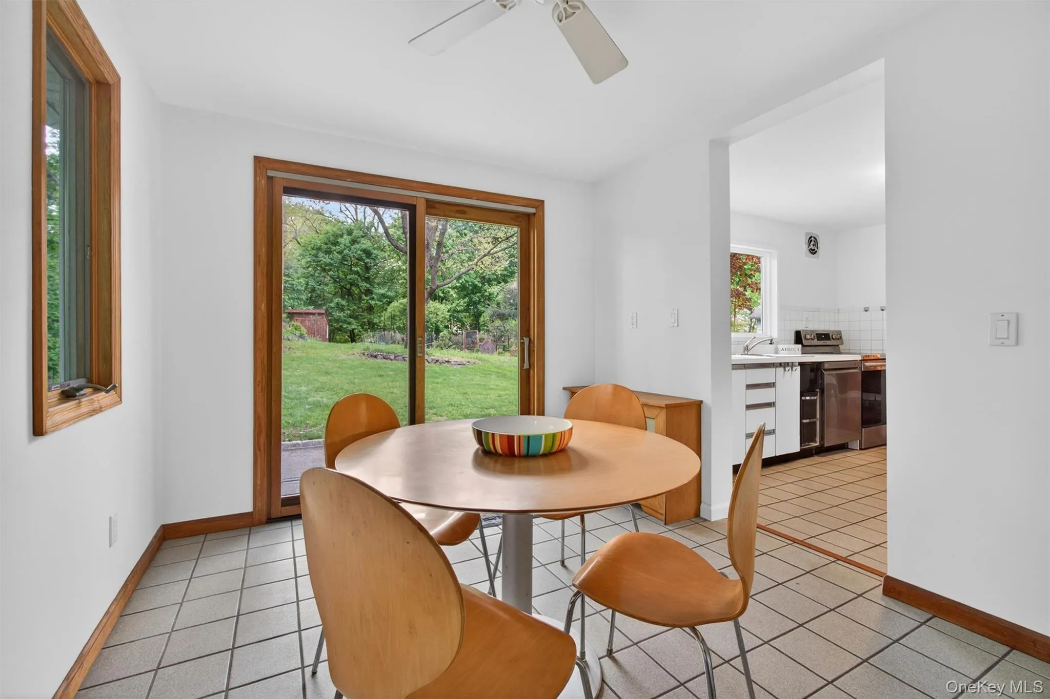 The breakfast room features sliding glass doors leading to the outdoor space. The breakfast room features sliding glass doors leading to the outdoor space.